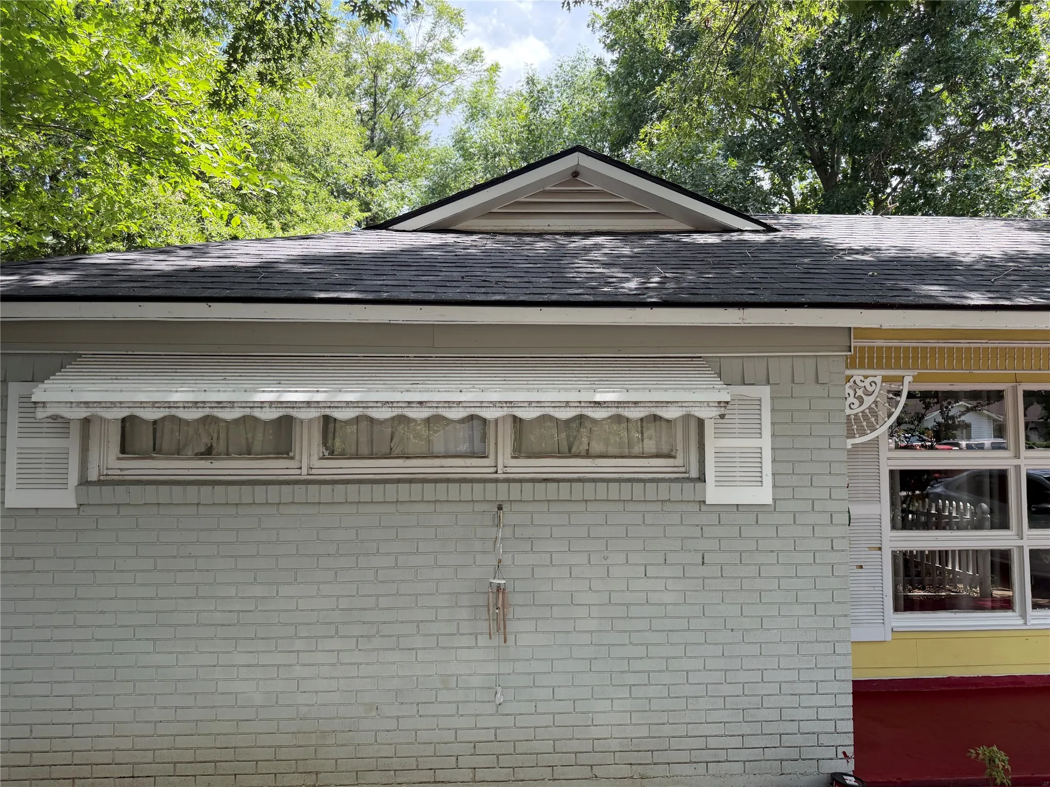 Brick exterior with a gray painted finish