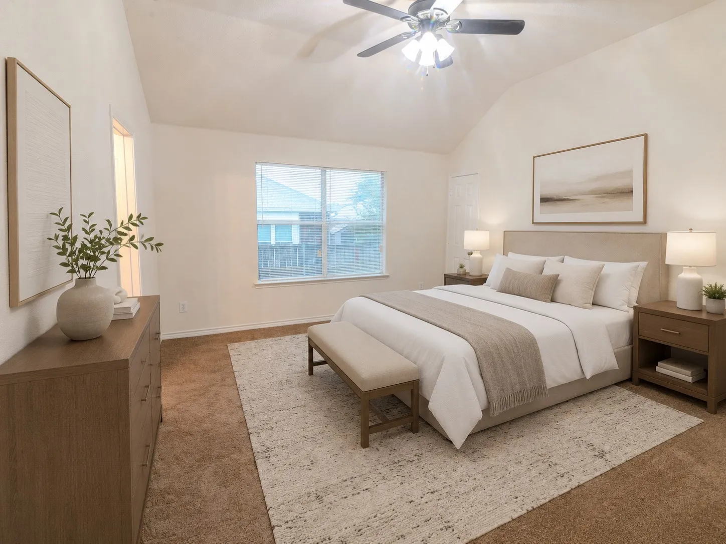 Virtually Staged Vaulted ceiling with an attached ceiling fan, large window with blinds, and neutral carpeting