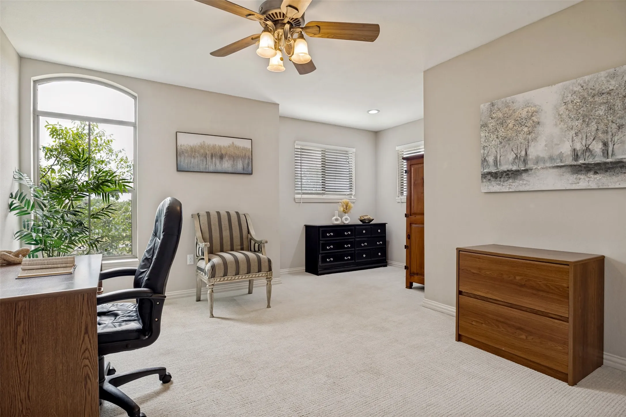 Spacious bonus room for office or bedroom featuring neutral carpeting and light-toned walls, closet