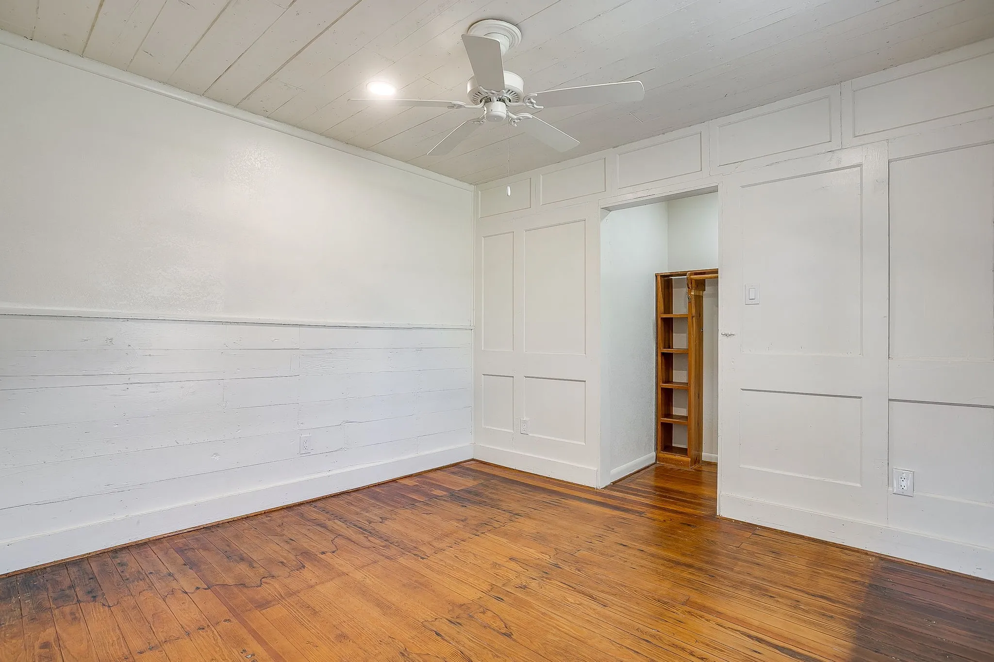 Spare room featuring hardwood / wood-style floors, a ceiling fan, and wood ceiling
