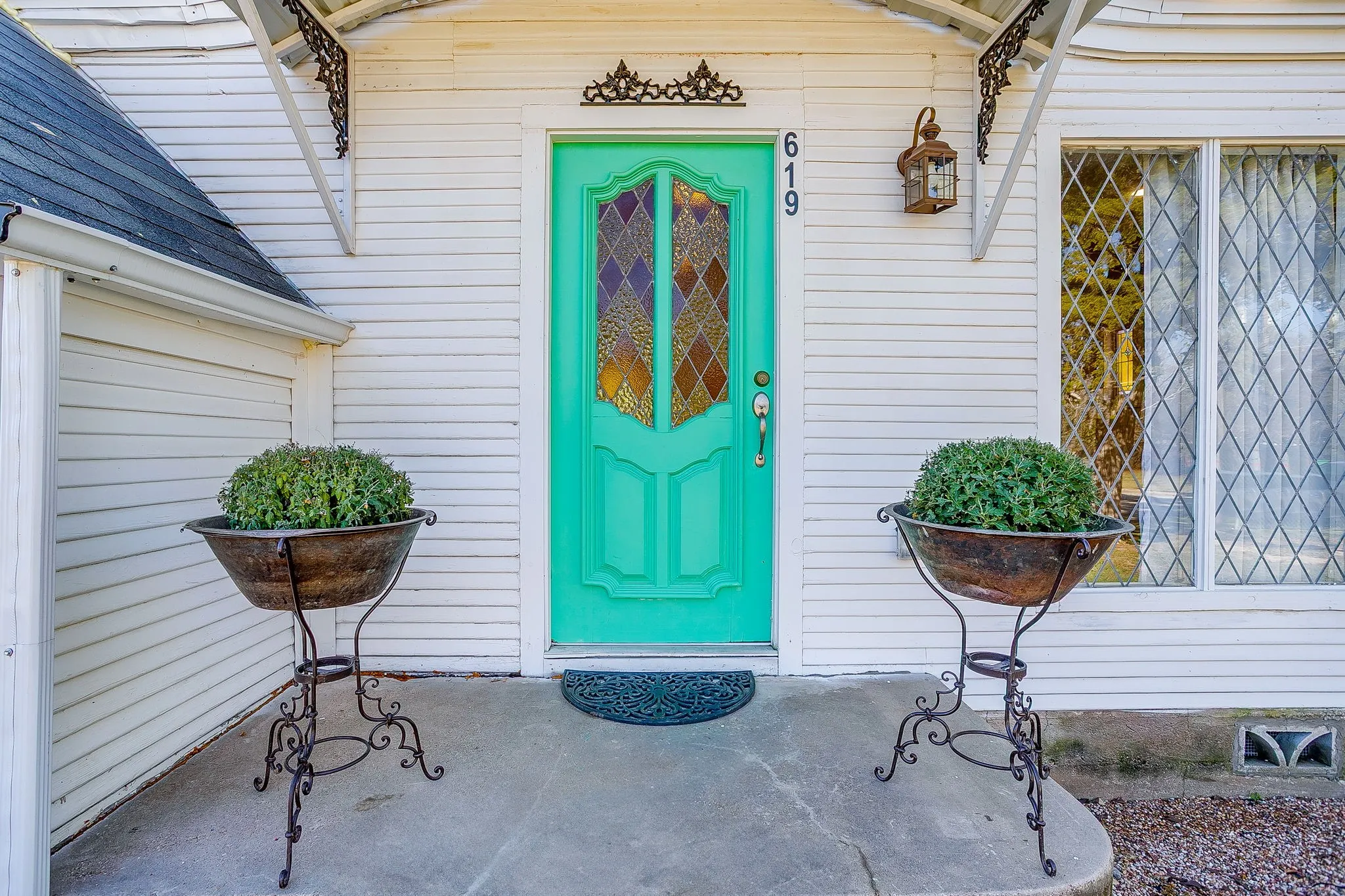Entrance to property with a shingled roof