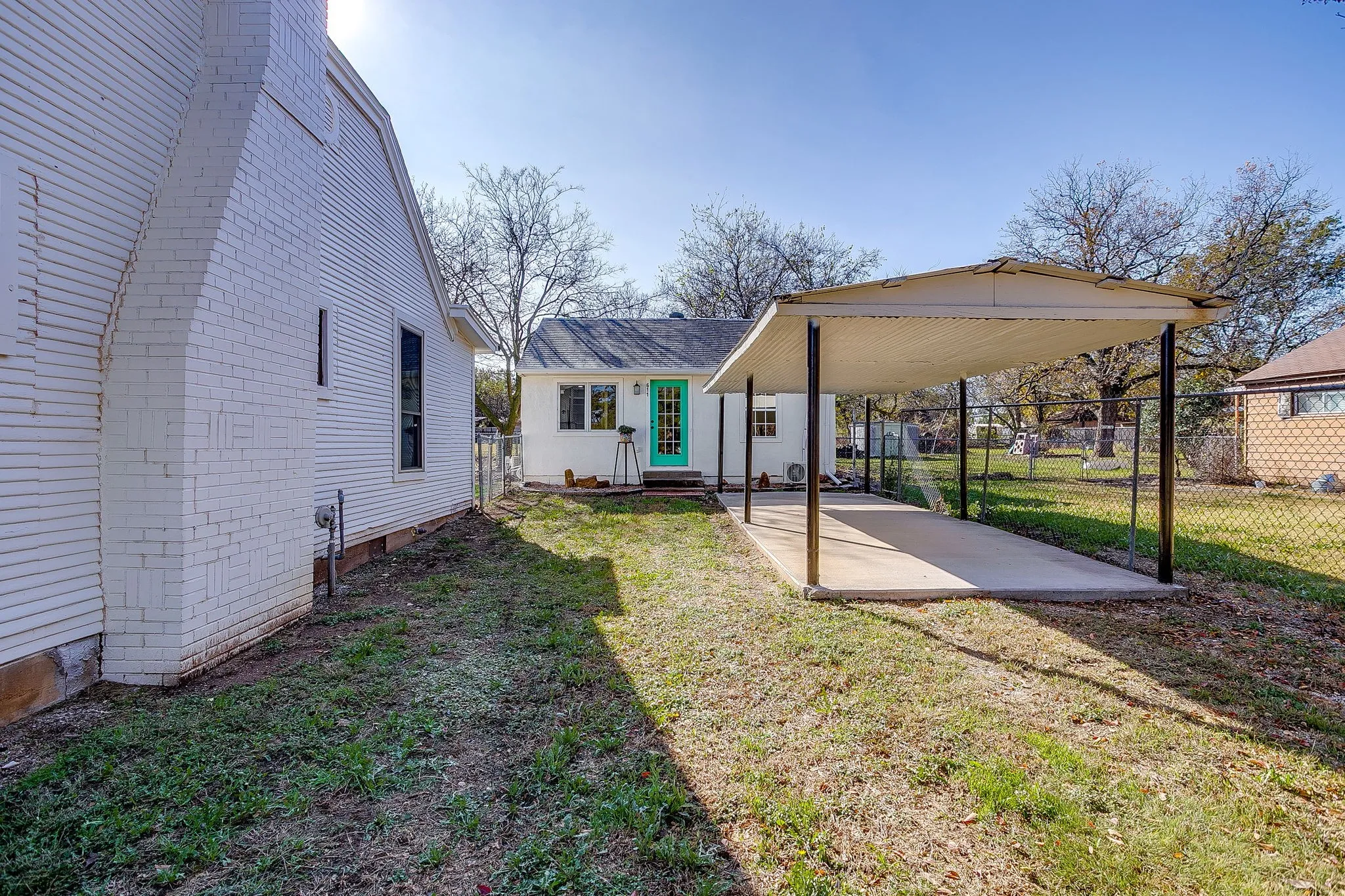 View of yard with a patio area and a detached carport
