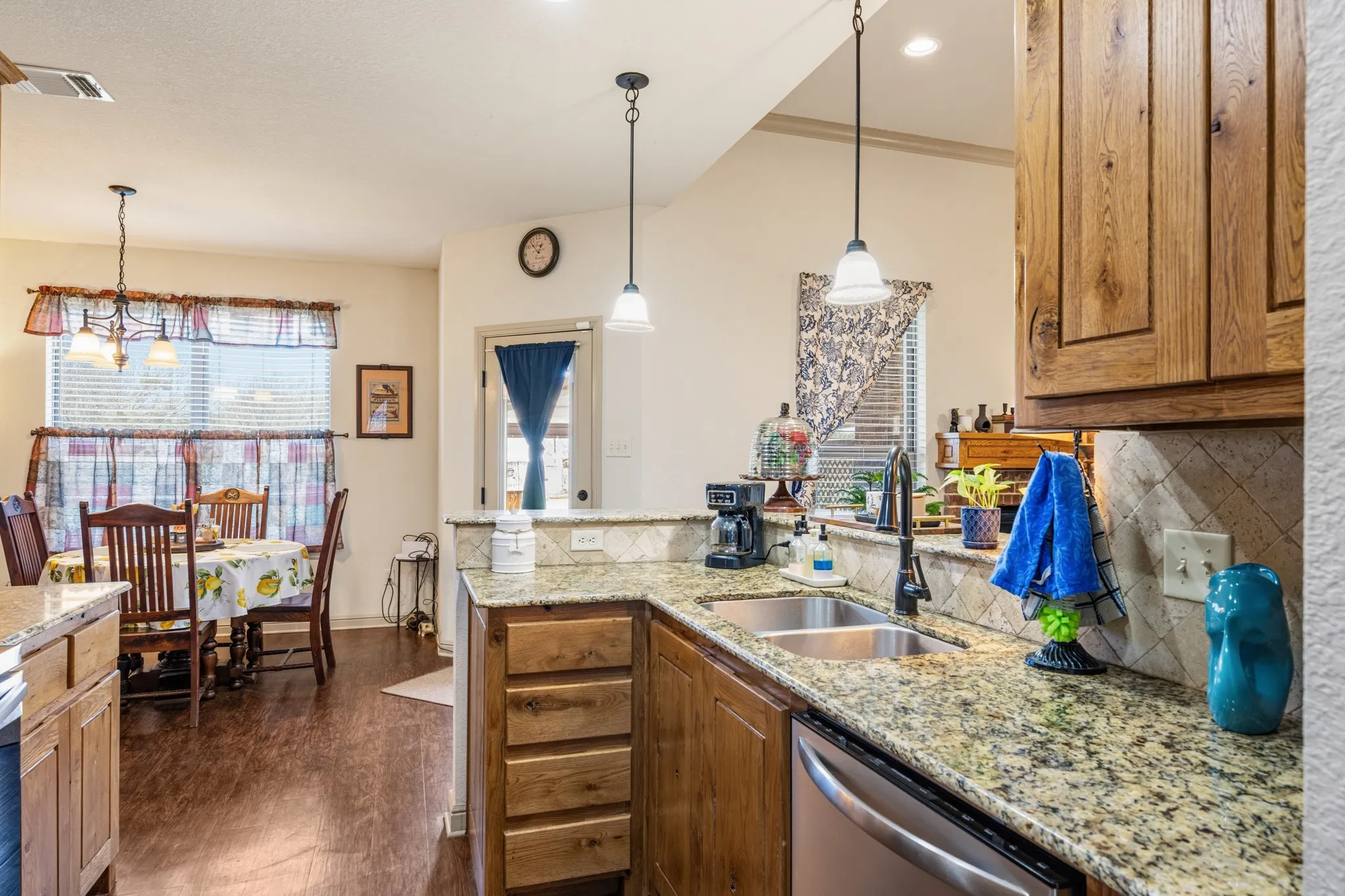 Kitchen uses space well with a good amount of cabinets and drawers.