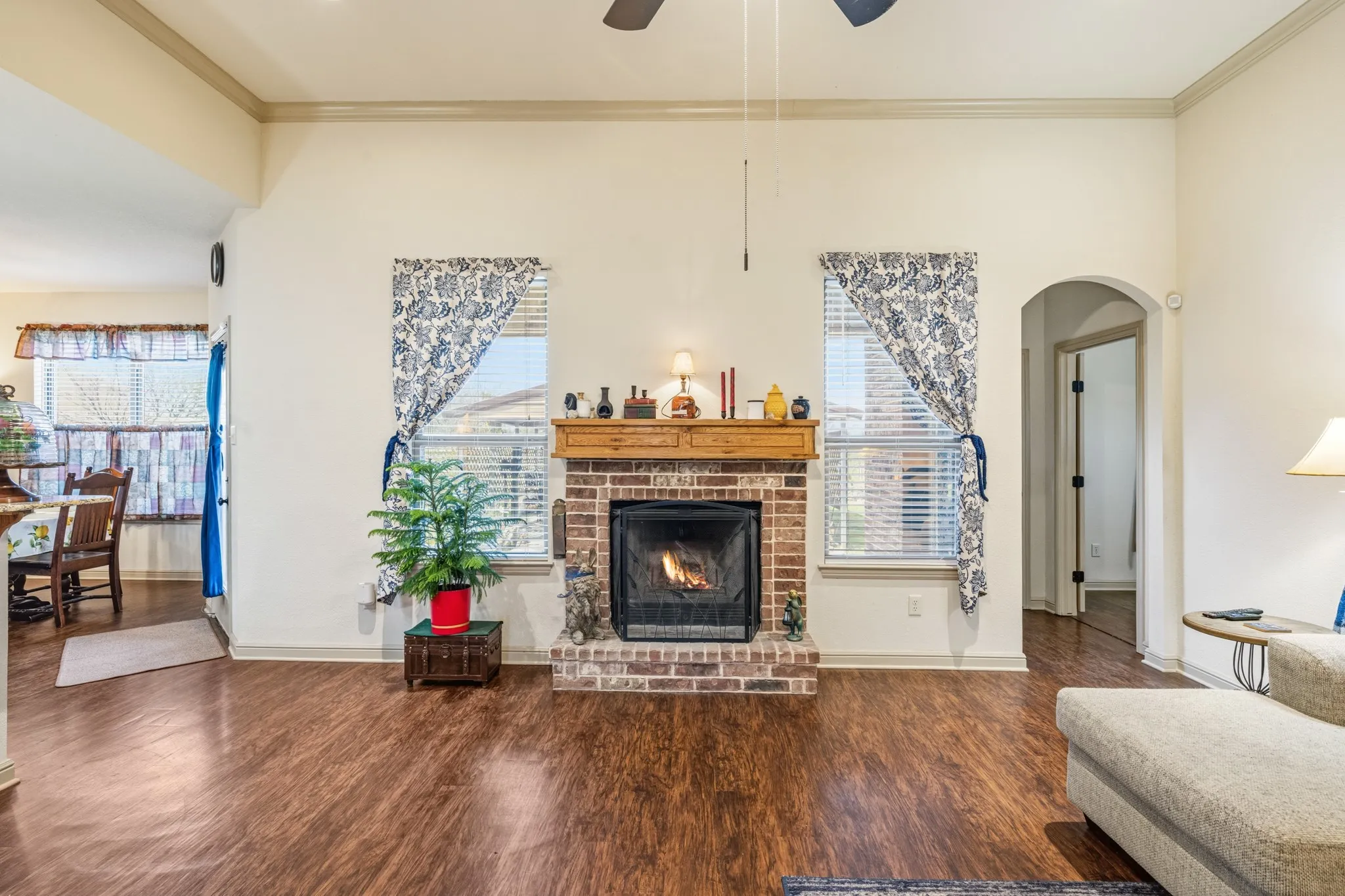 Brick fireplace is a focal point in the living room.