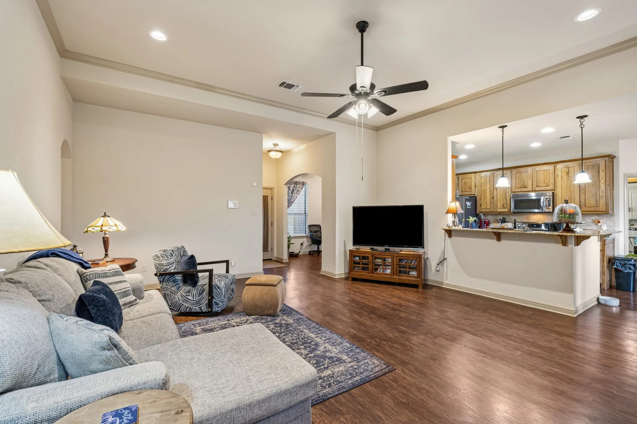 Spacious living room is open to kitchen and breakfast area.