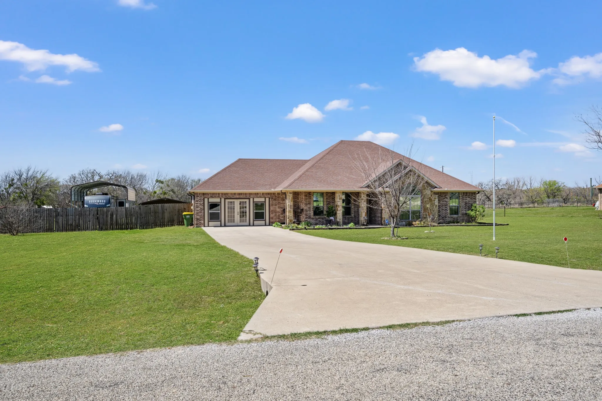 Large driveway creates extra parking space.