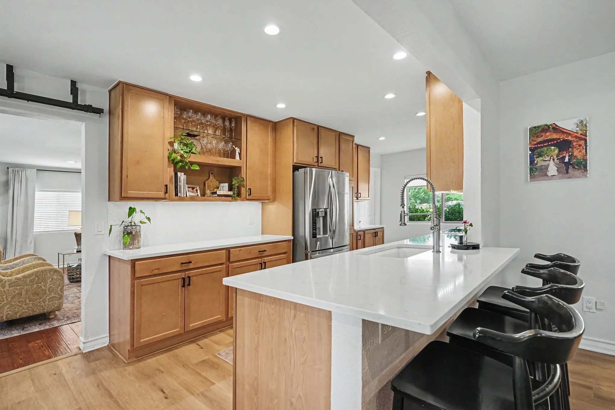 Newly updated Kitchen with quartz counter tops, recessed and motion under mount lighting. Stainless steel appliances.