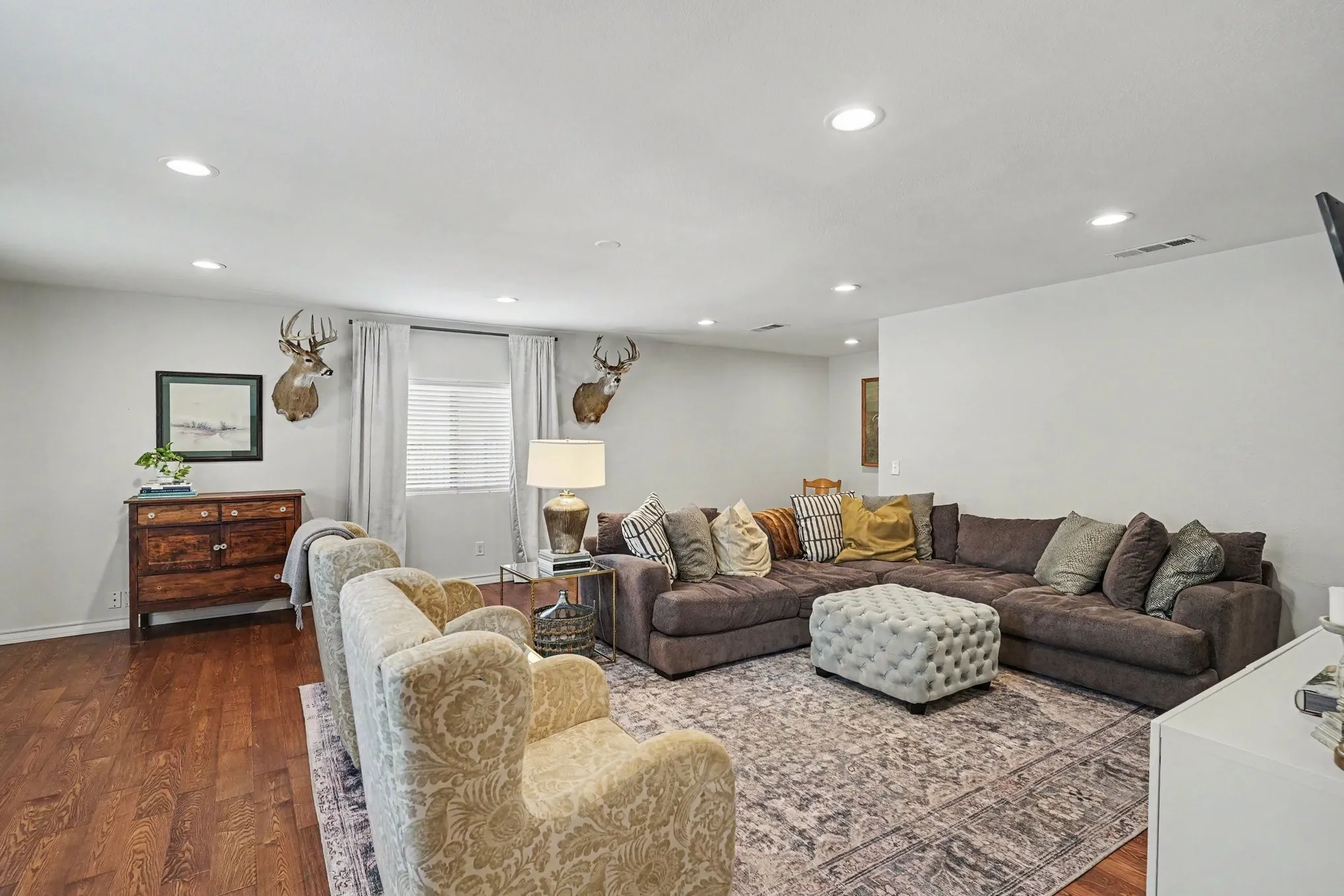 Extra large family room with sliding barn door for privacy or used as a guest room.