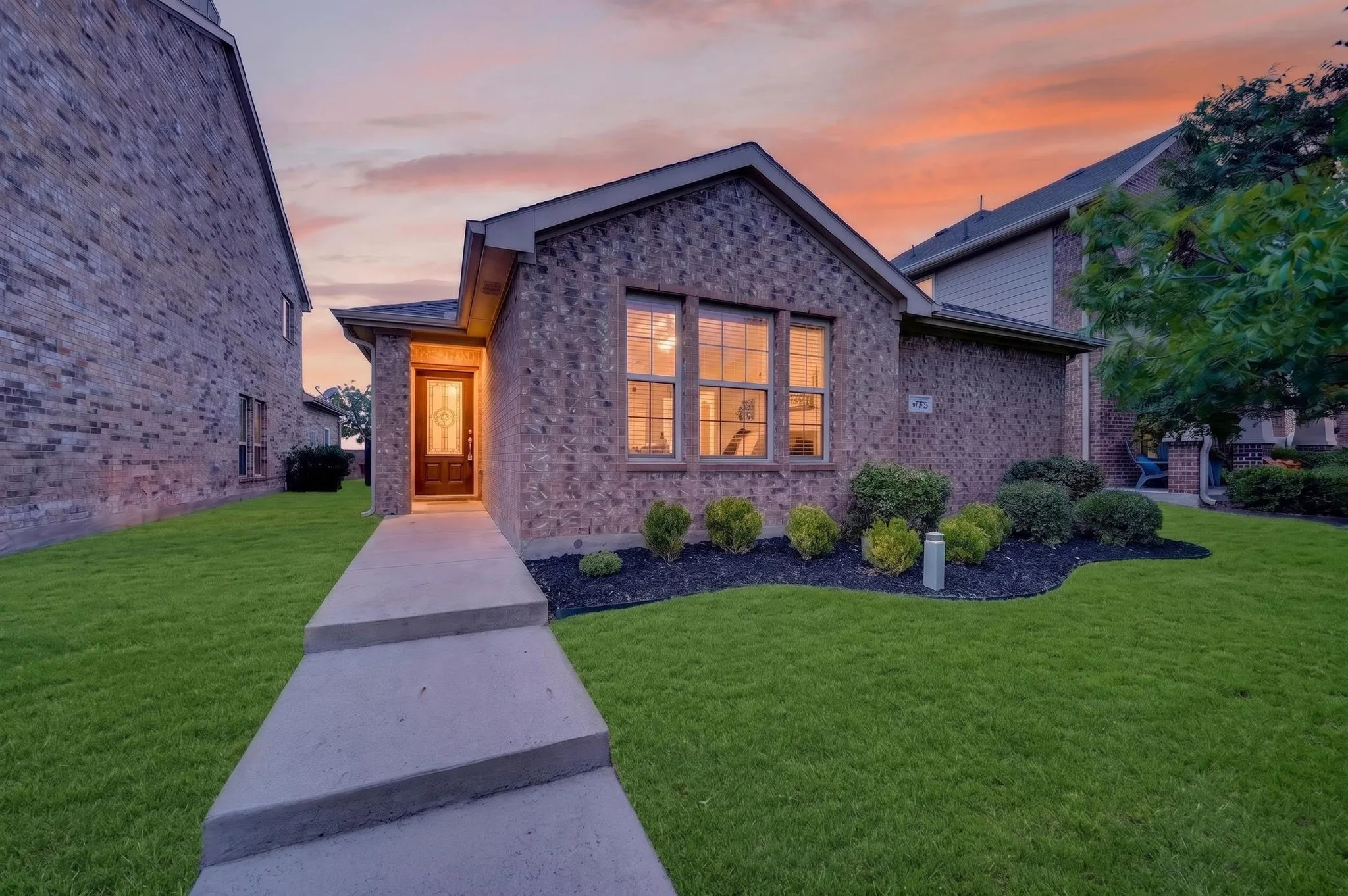 Brick exterior with a covered entry