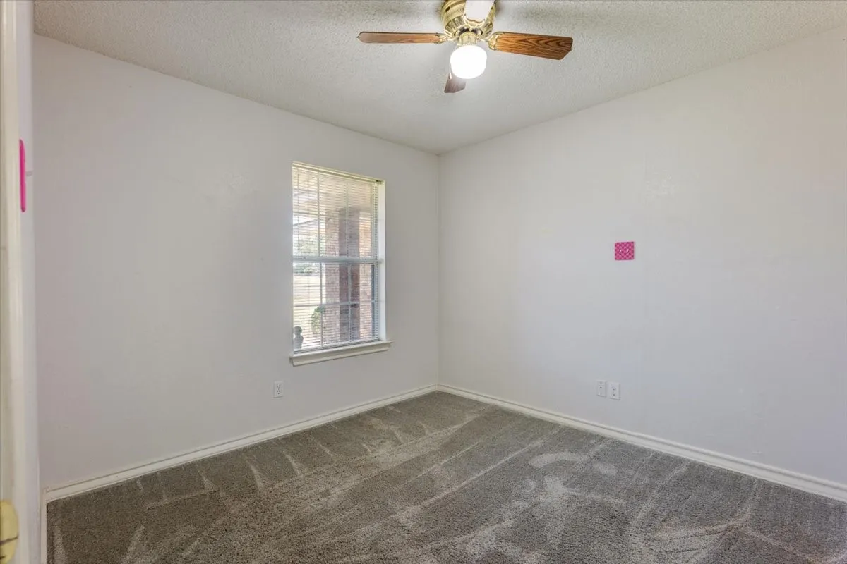 Secondary bedroom across hall from full bath