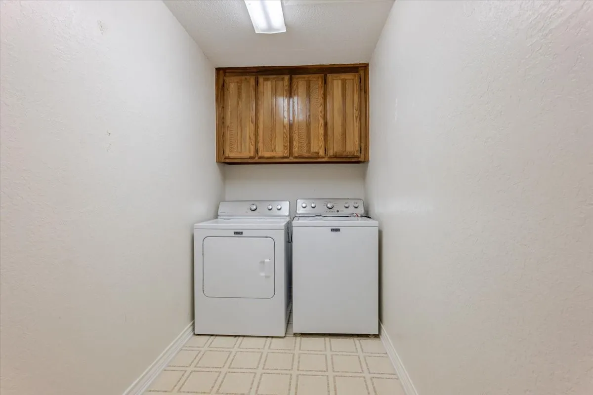 Large utility room with cabinets