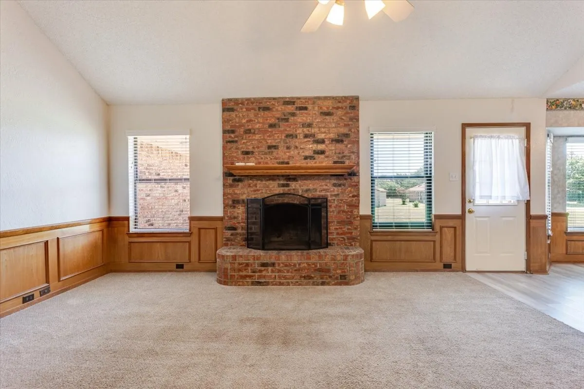 Wood burning fireplace with raised hearth adds character and comfort