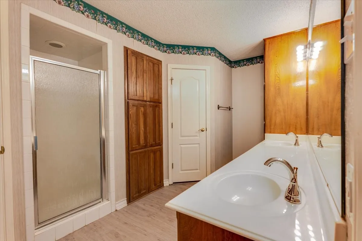 Dual sinks, two walk in closets, separate shower