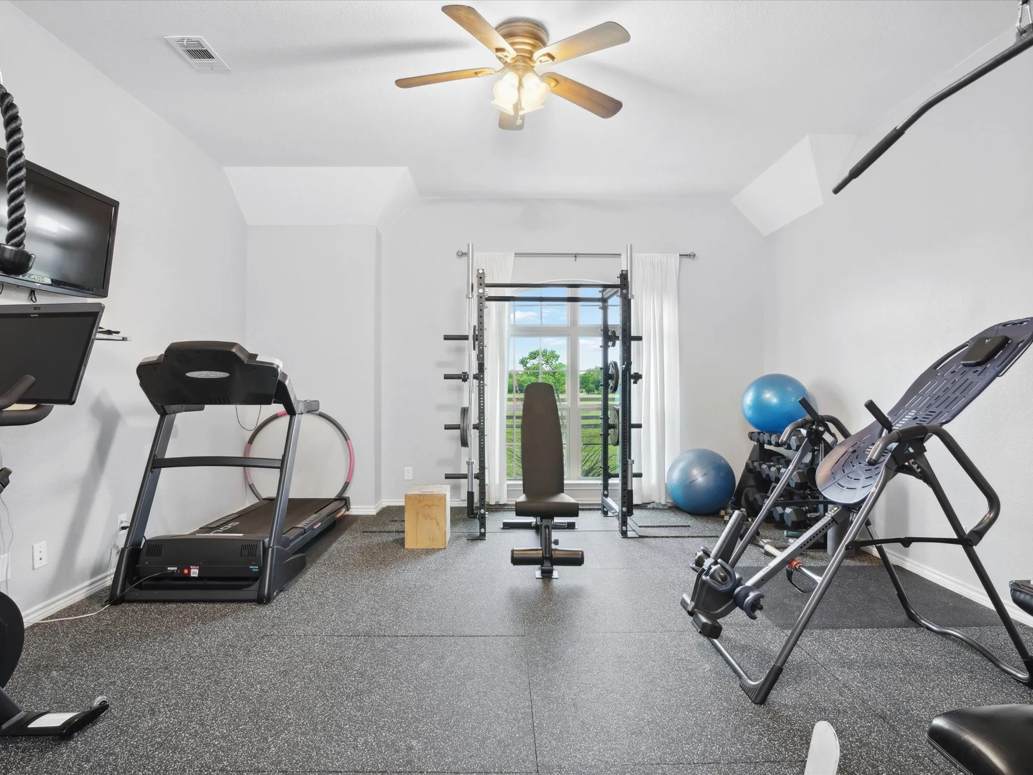 A workout room that can easily become a bedroom