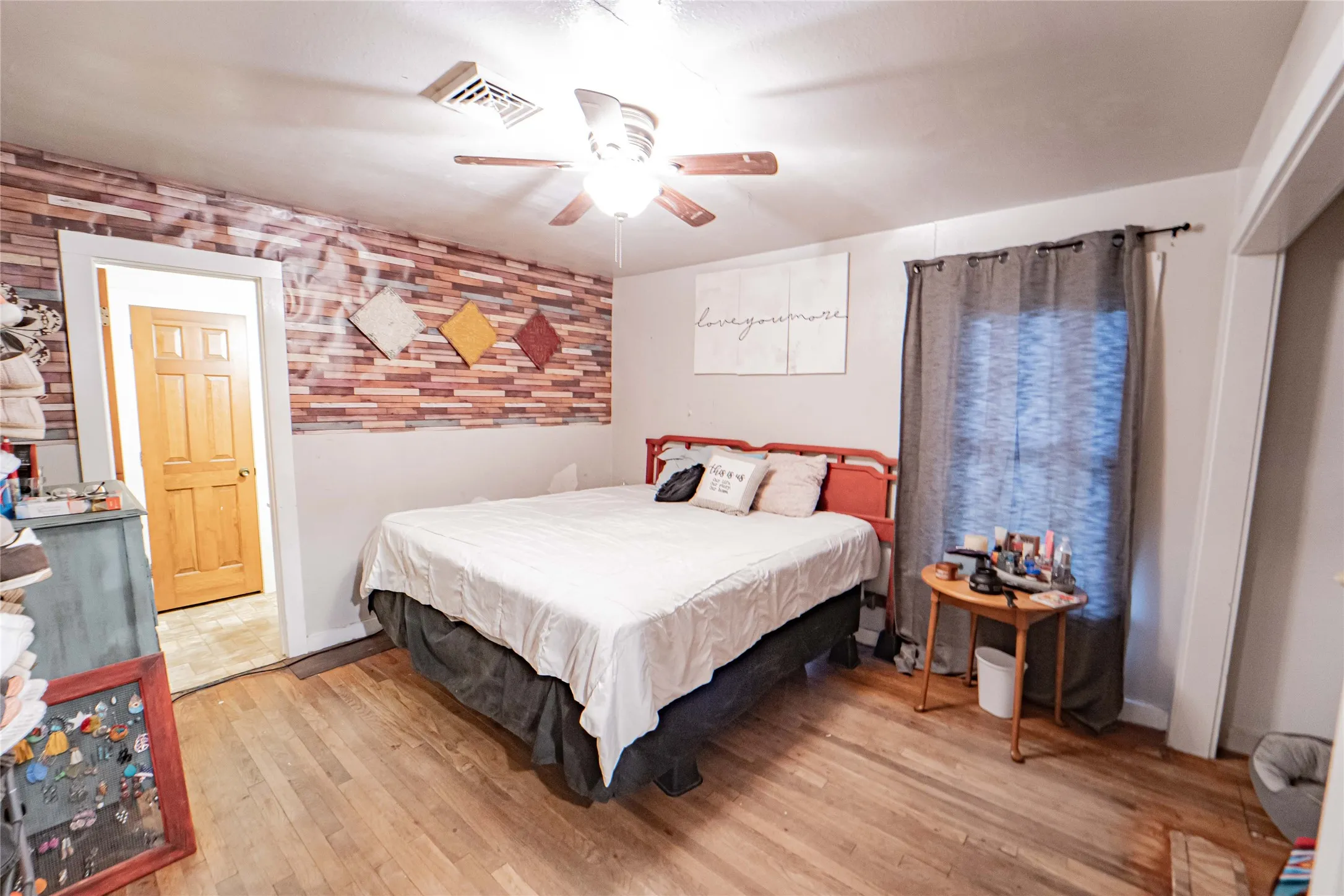 Hardwood flooring and textured accent wall