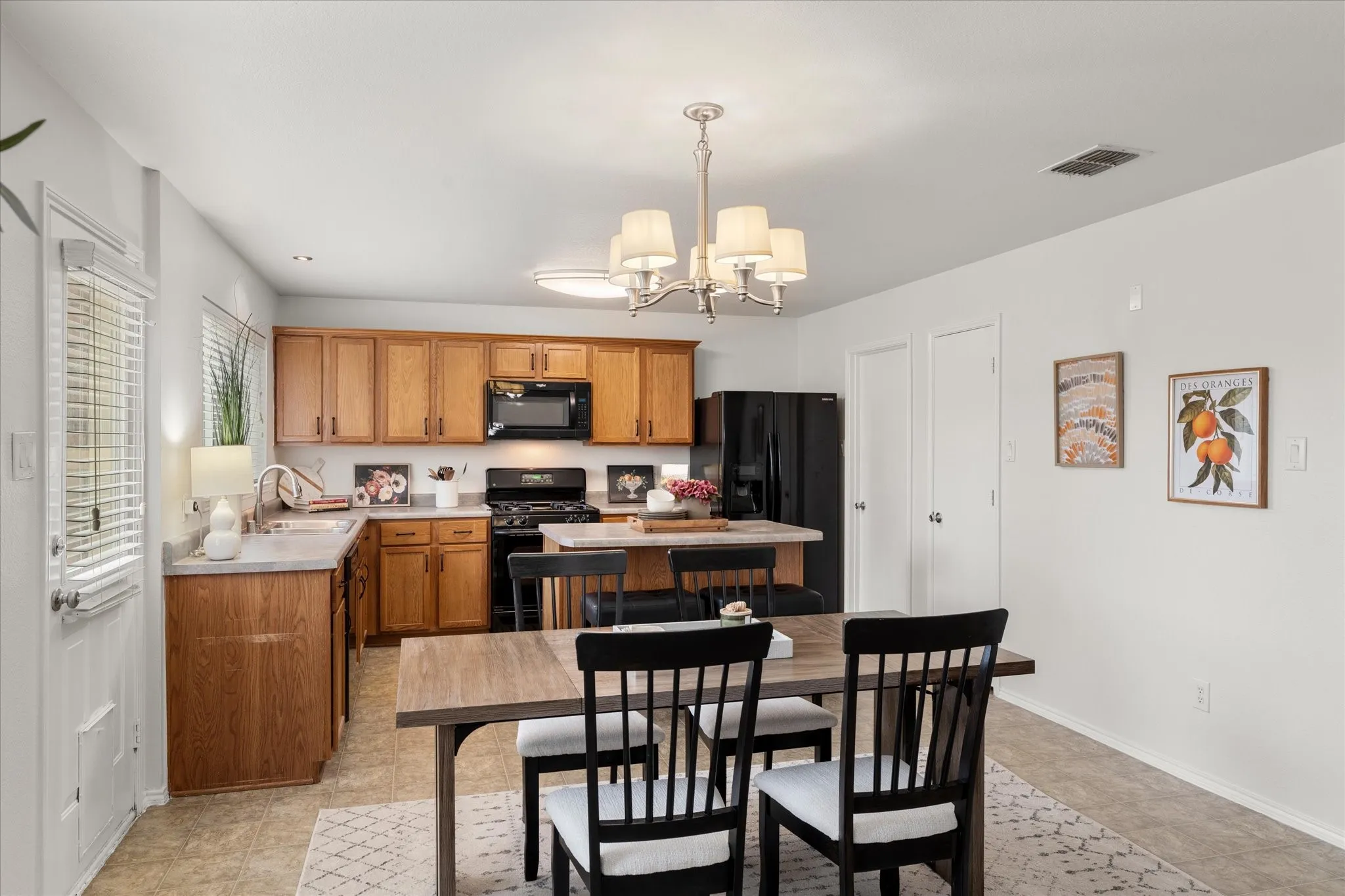 An inviting island serves as the perfect spot for casual meals or prepping tonights dinner.