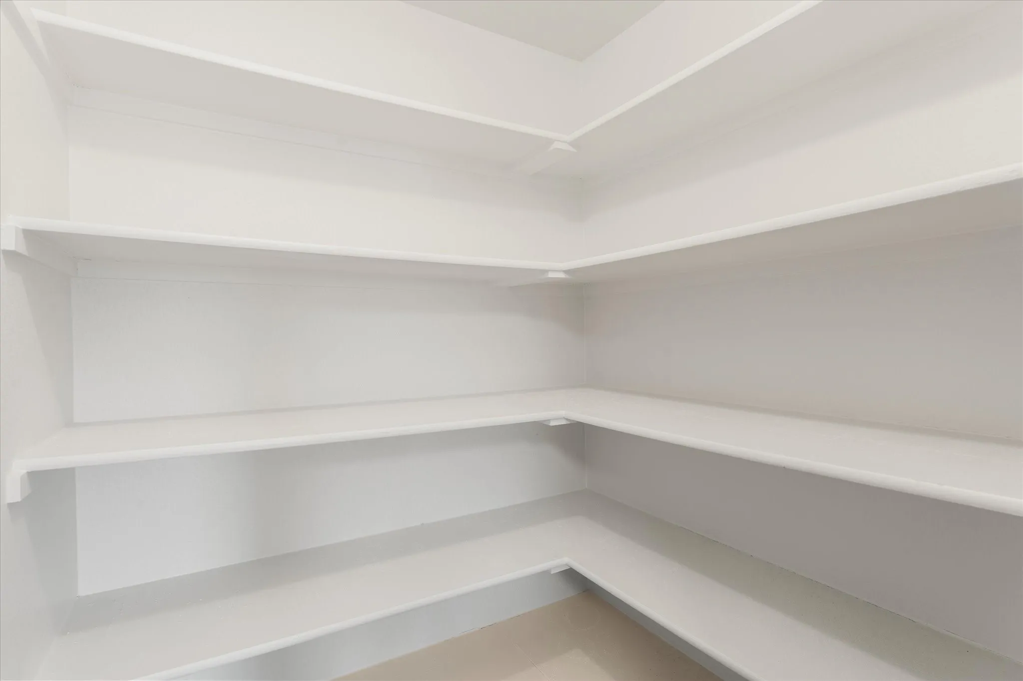 Check out the size of this fabulous pantry! We love the storage in this home!