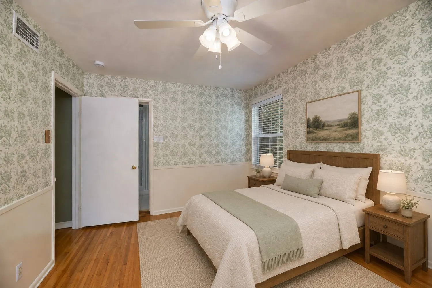 Virtually Staged - Interior room featuring patterned wallpaper, wood-finish flooring, and a ceiling fan with integrated lighting