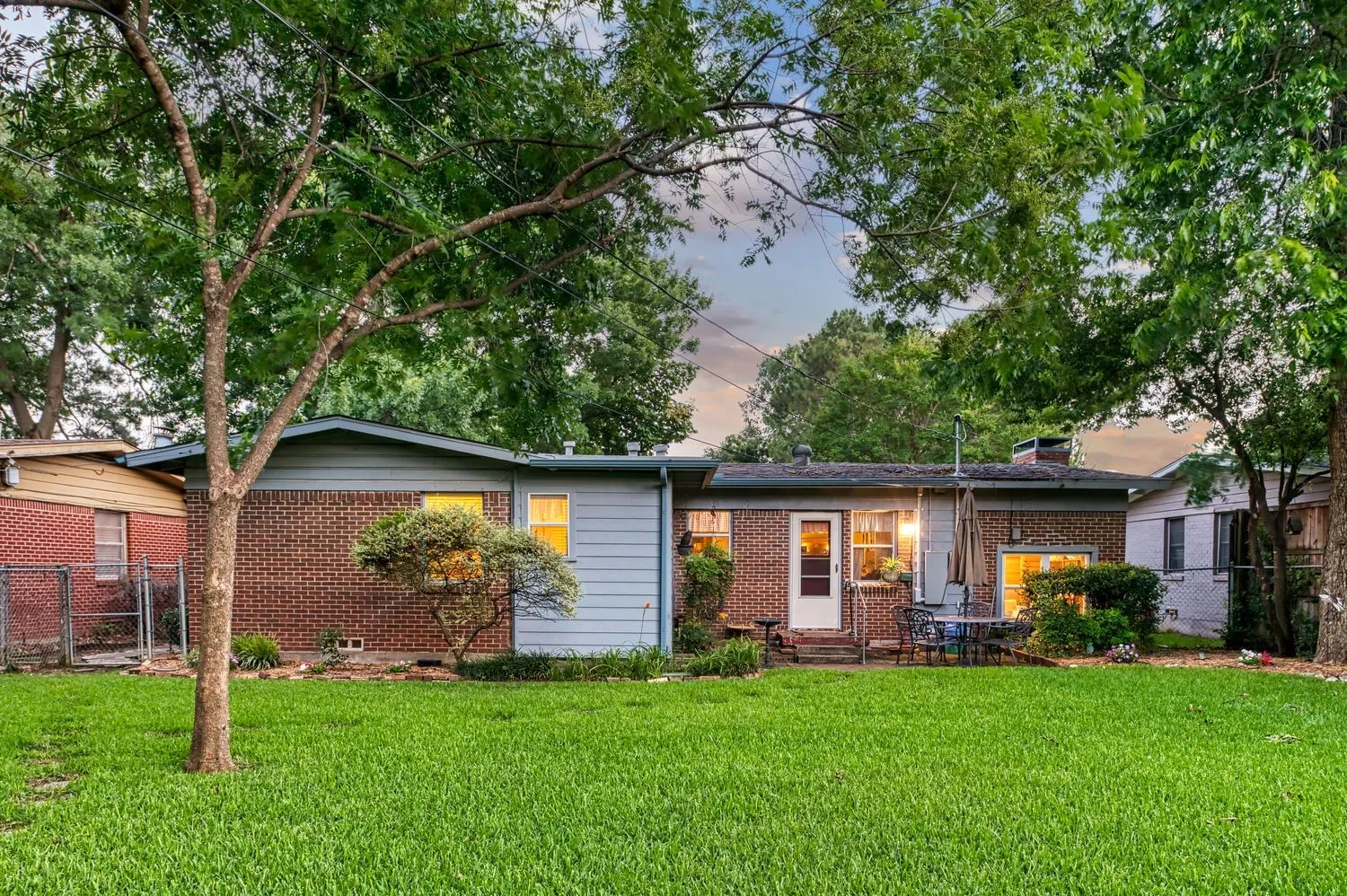 Backyard lawn offers room for pets, play, gardening, or outdoor dining.