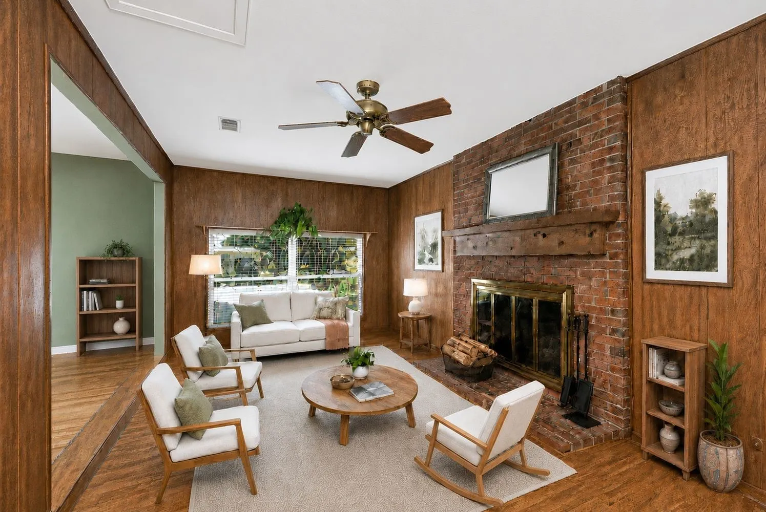 Virtualy Staged - Living area featuring wood-finish wall paneling and a brick fireplace with a wood mantle