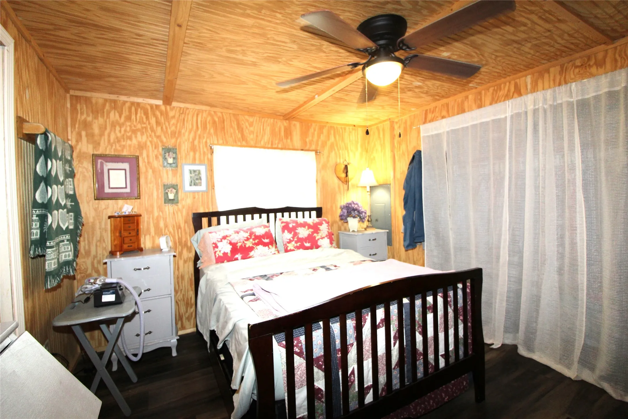 Interior room featuring wood-finish walls and ceiling