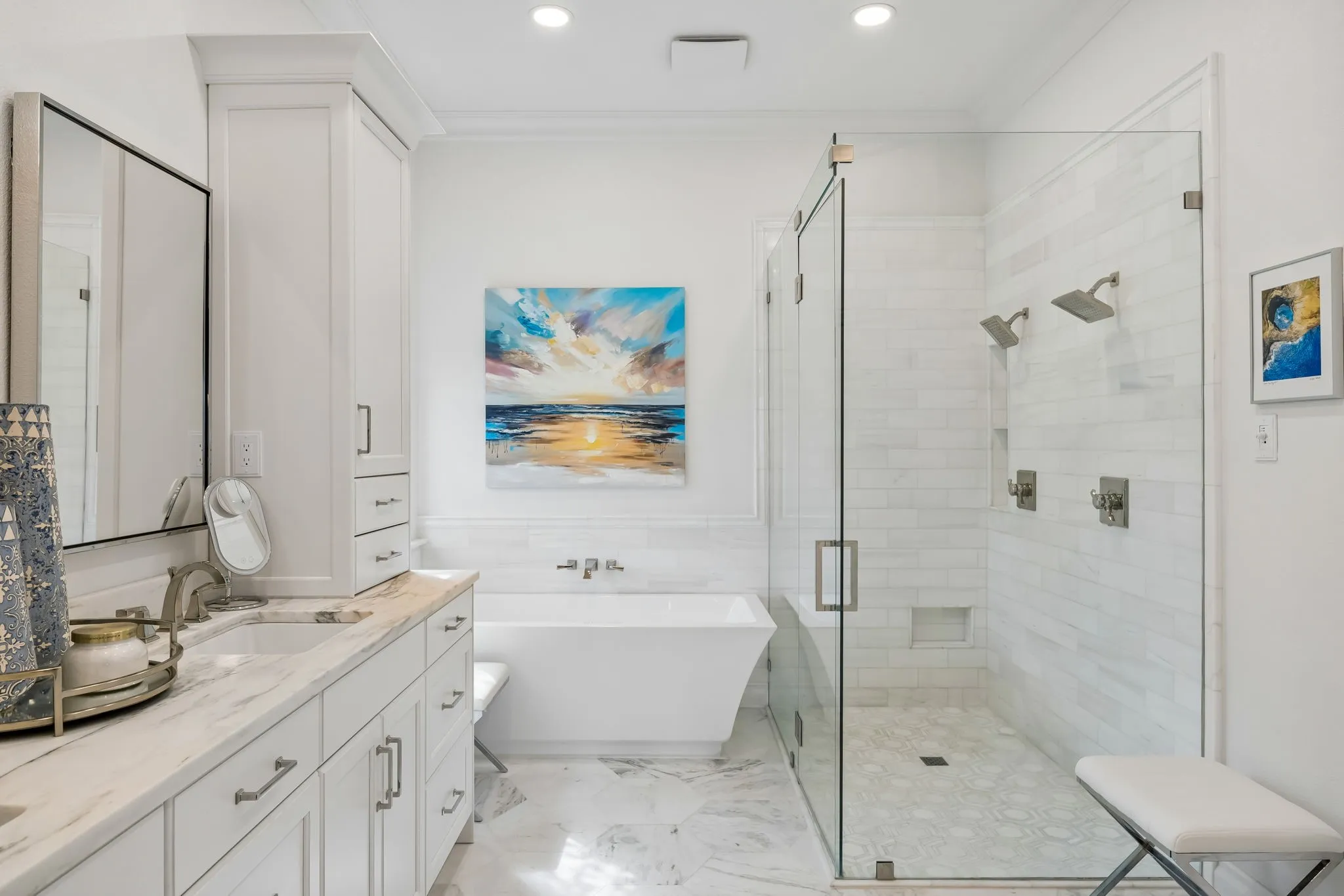 Ensuite bathroom featuring a frameless glass shower enclosure, a freestanding soaking tub and marble flooring