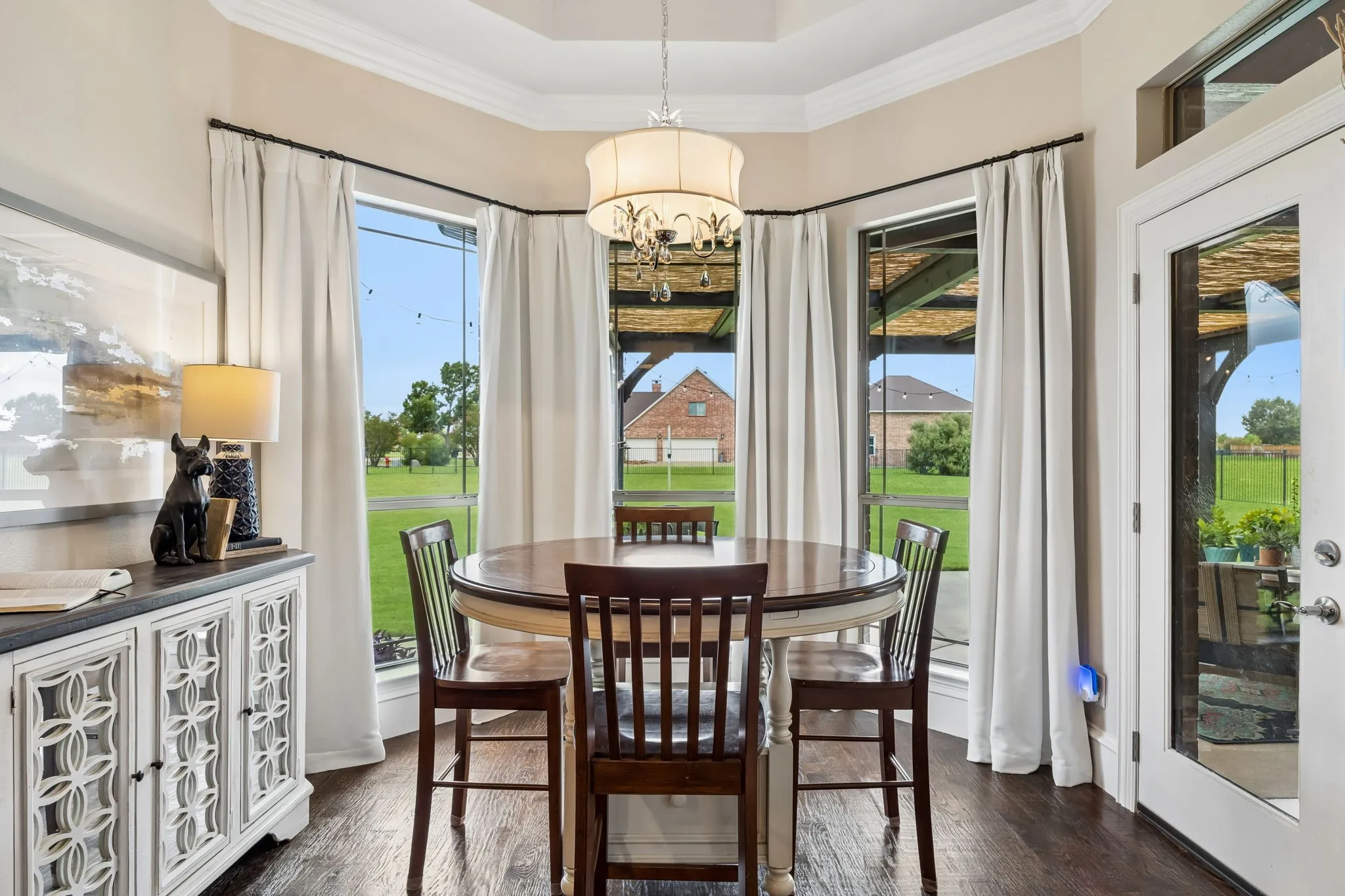 Breakfast area with tray ceiling and views of the Texas sized back yard
