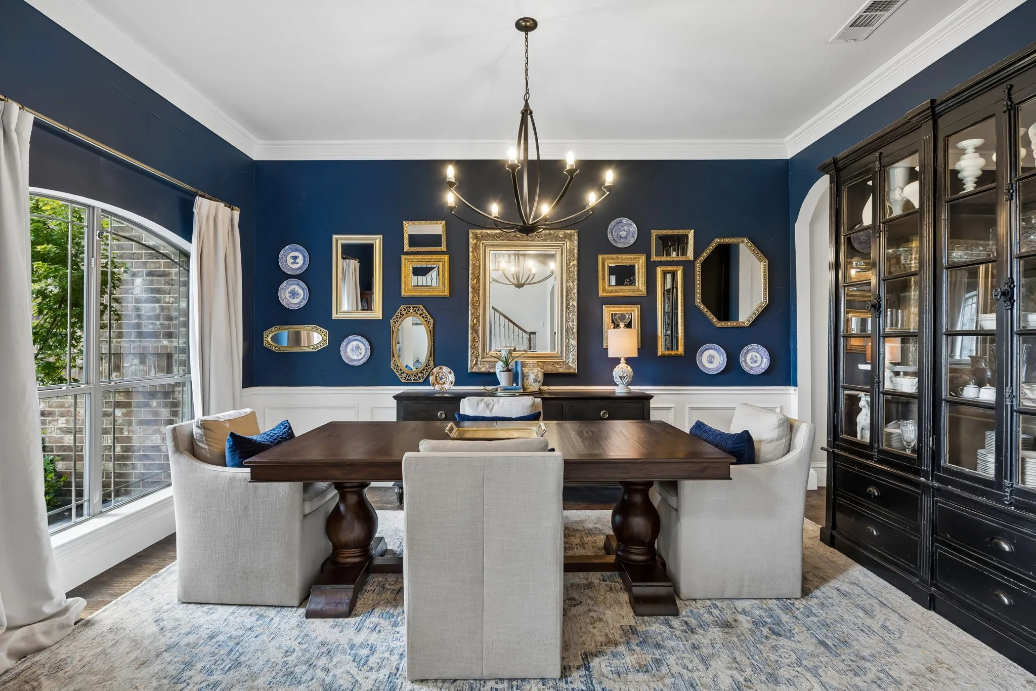 Formal dining area featuring crown molding and a chandelier.