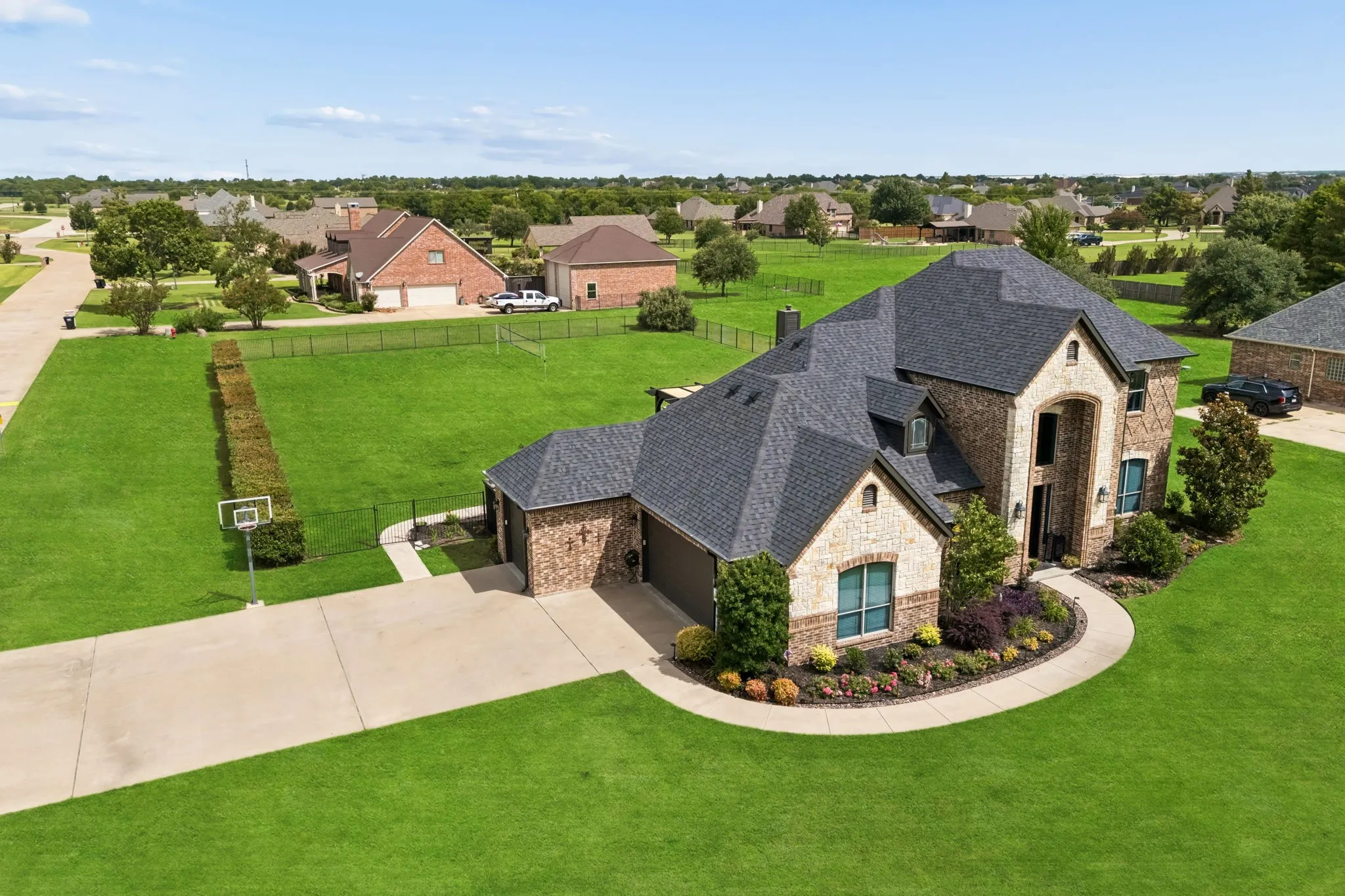 A 3 car garage is on the side of the home