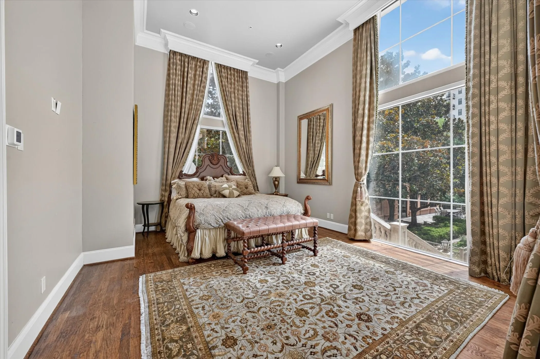 Floor-to-ceiling windows & French doors to the Balcony grace the dual Primary Bedrooms.