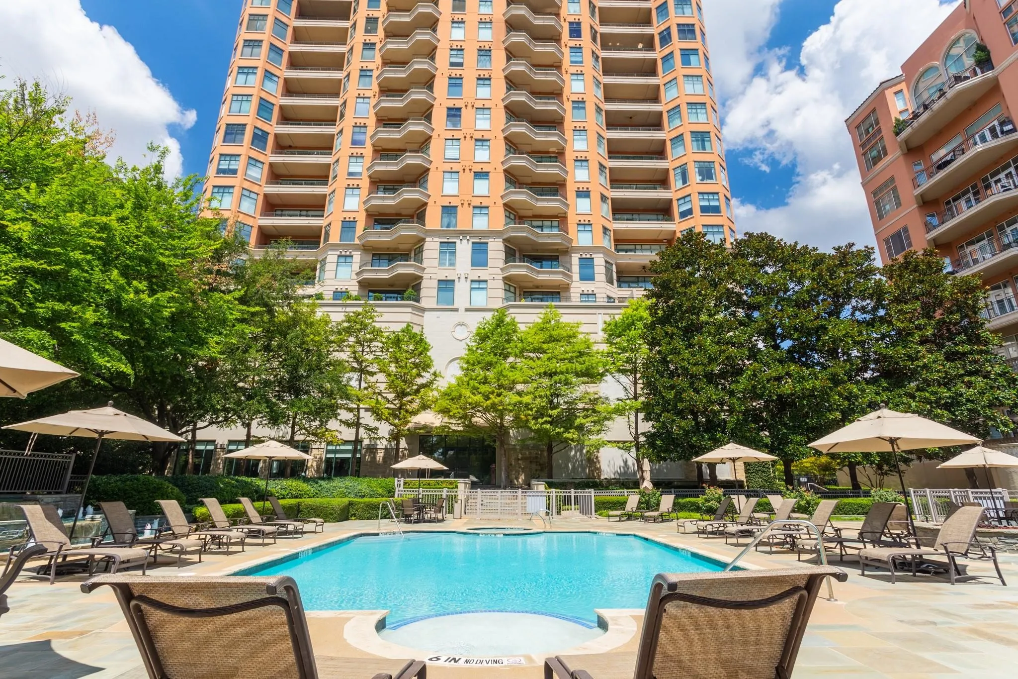 Beautifully revamped pool area has plentiful entertaining space & towel service..