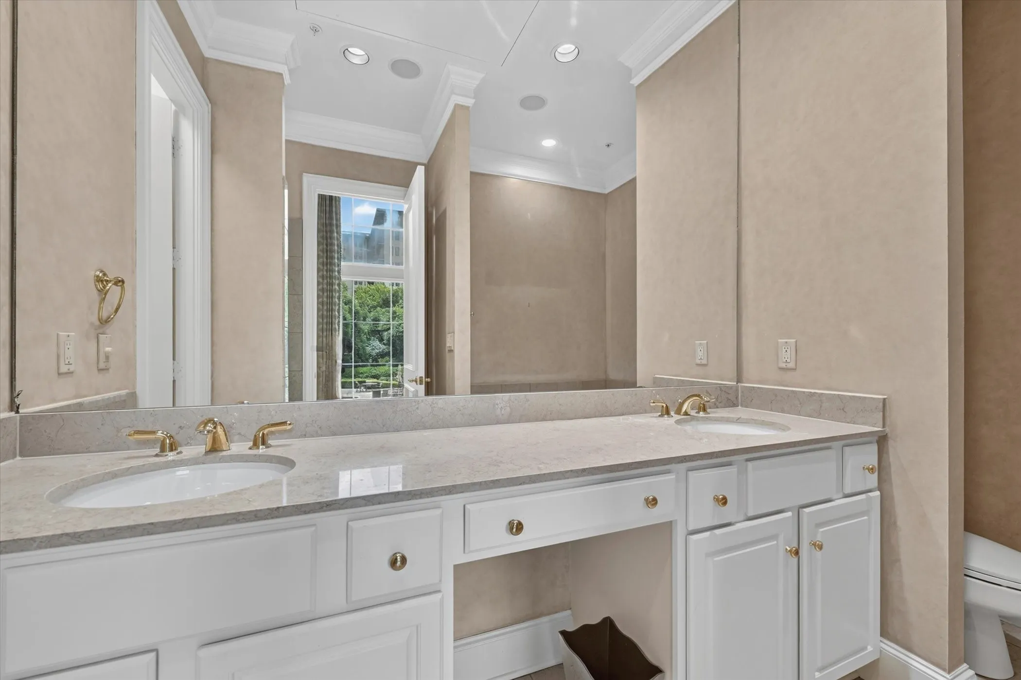 Marble Primary Bath has dual sinks.