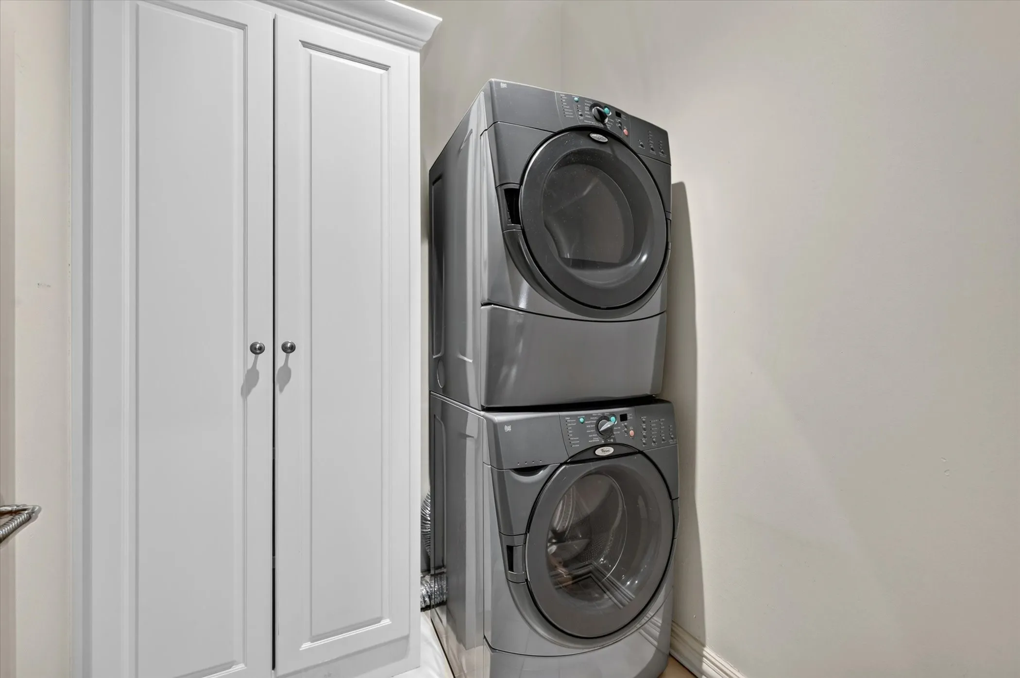 Full-sized stack washer/dryer off of Kitchen allow for extra storage.