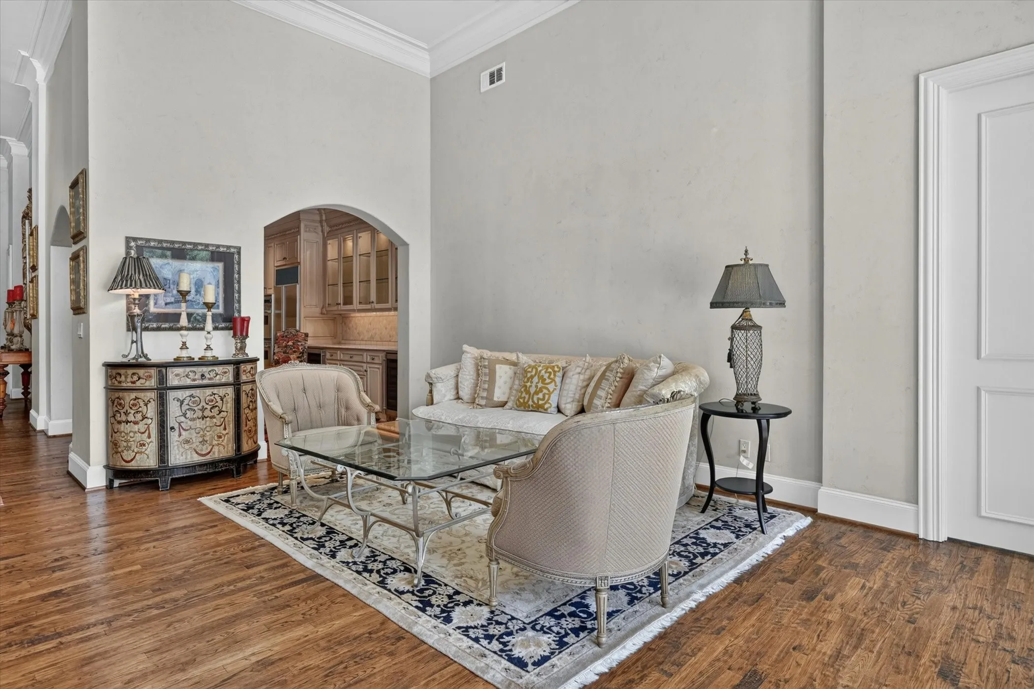 Second seating area in the Living Room has wood floors & soaring ceiling.