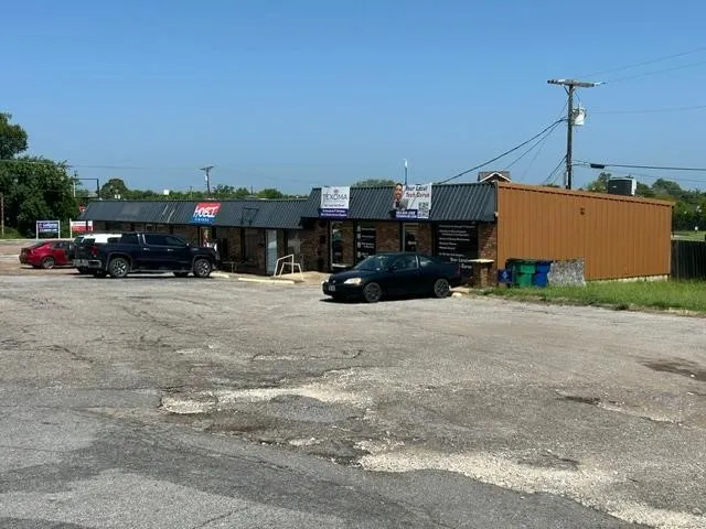 Side visual of building and parking lot