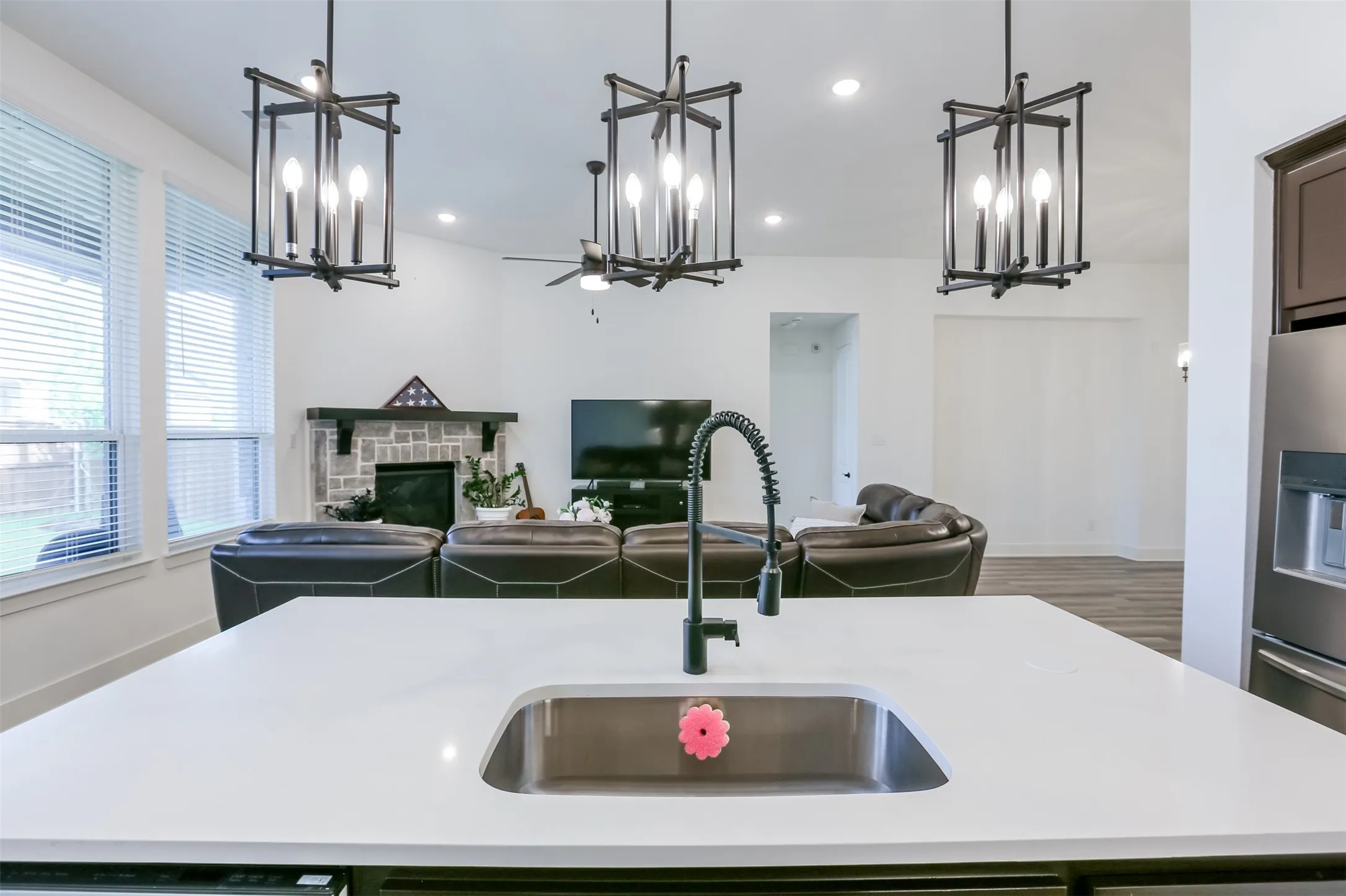 View of kitchen overlooking living area