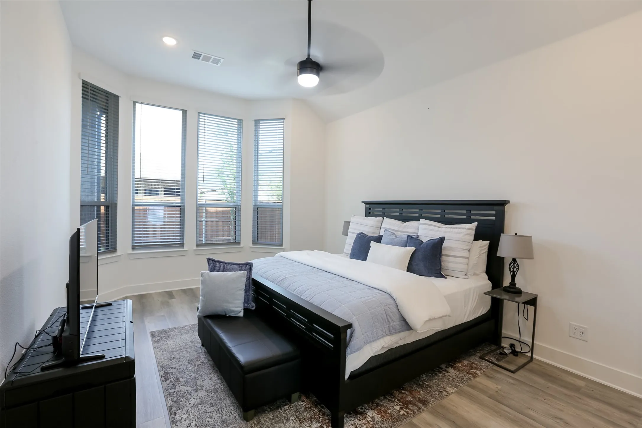 View of primary bedroom with ceiling fan