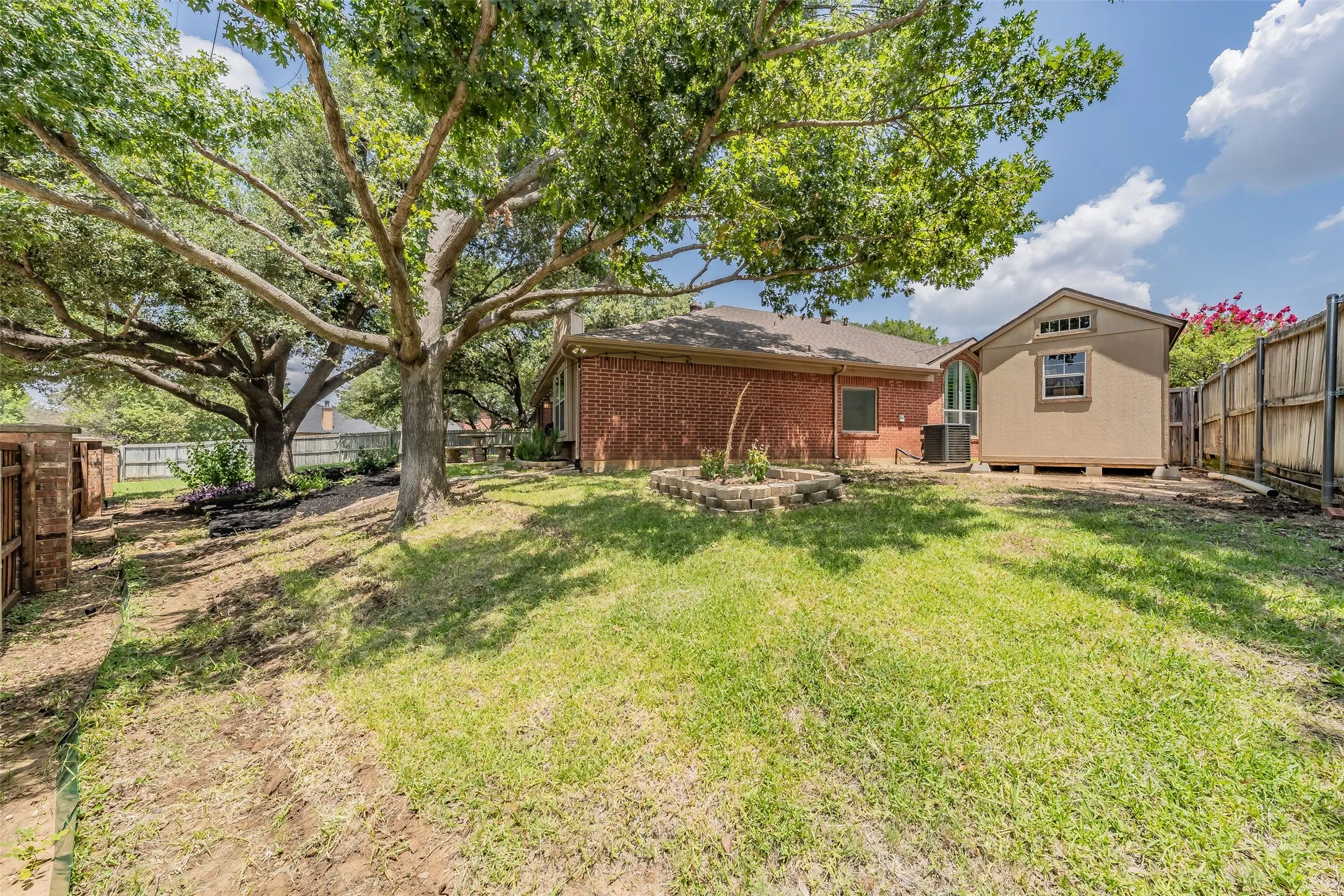 Large backyard with storage shed & large shade trees!
