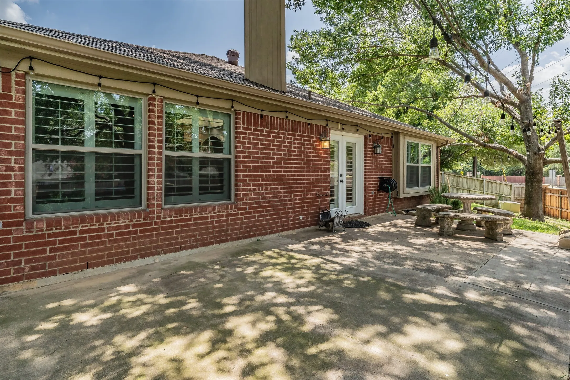 Large patio in backyard ready for summertime fun!