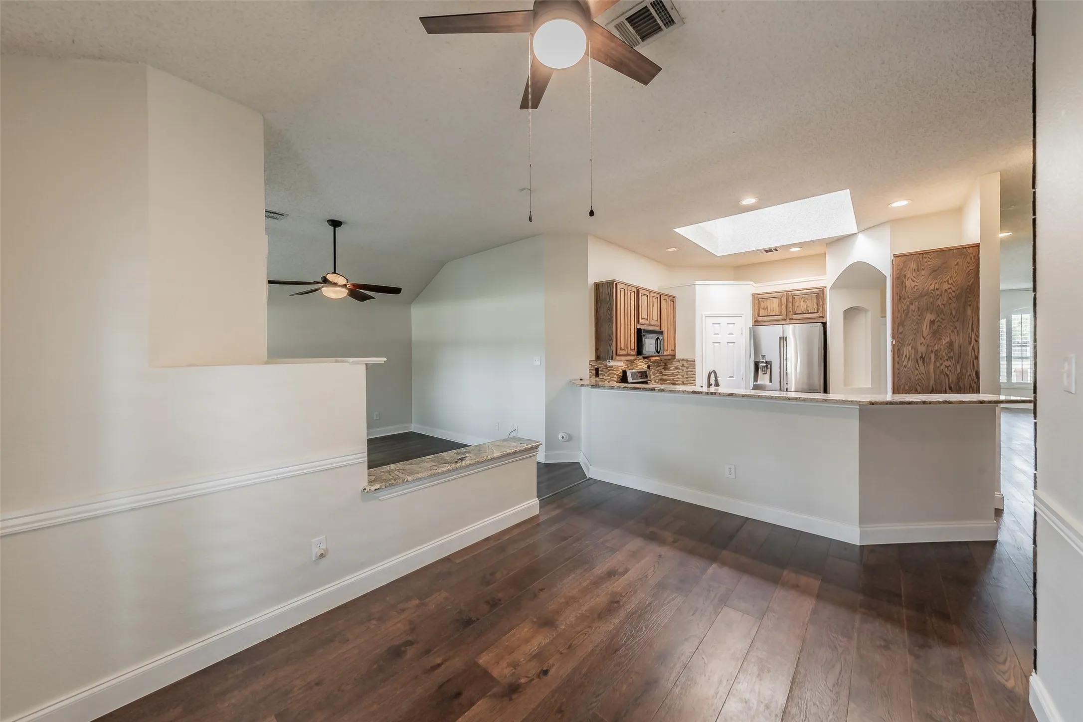 Breakfast area is open to the kitchen.  Breakfast bar offers additional seating space.