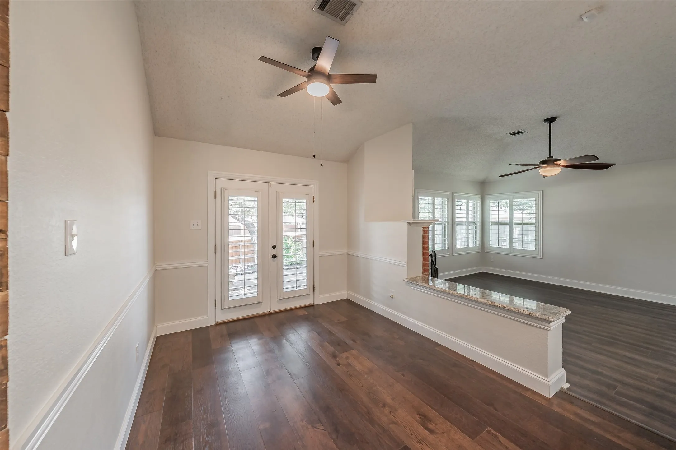 Breakfast area off of the kitchen & open to the family room.  French doors with plantation shutters exit to the large patio & backyard.