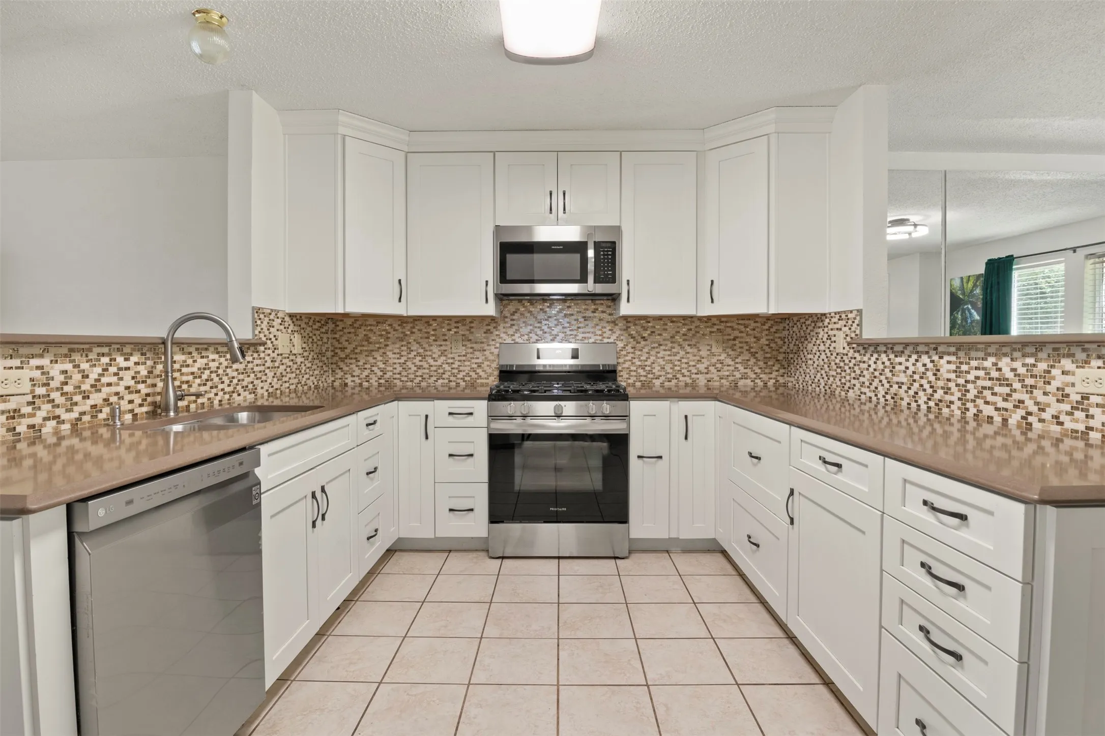 Natural stone countertops, deep drawers, soft close cabinets.