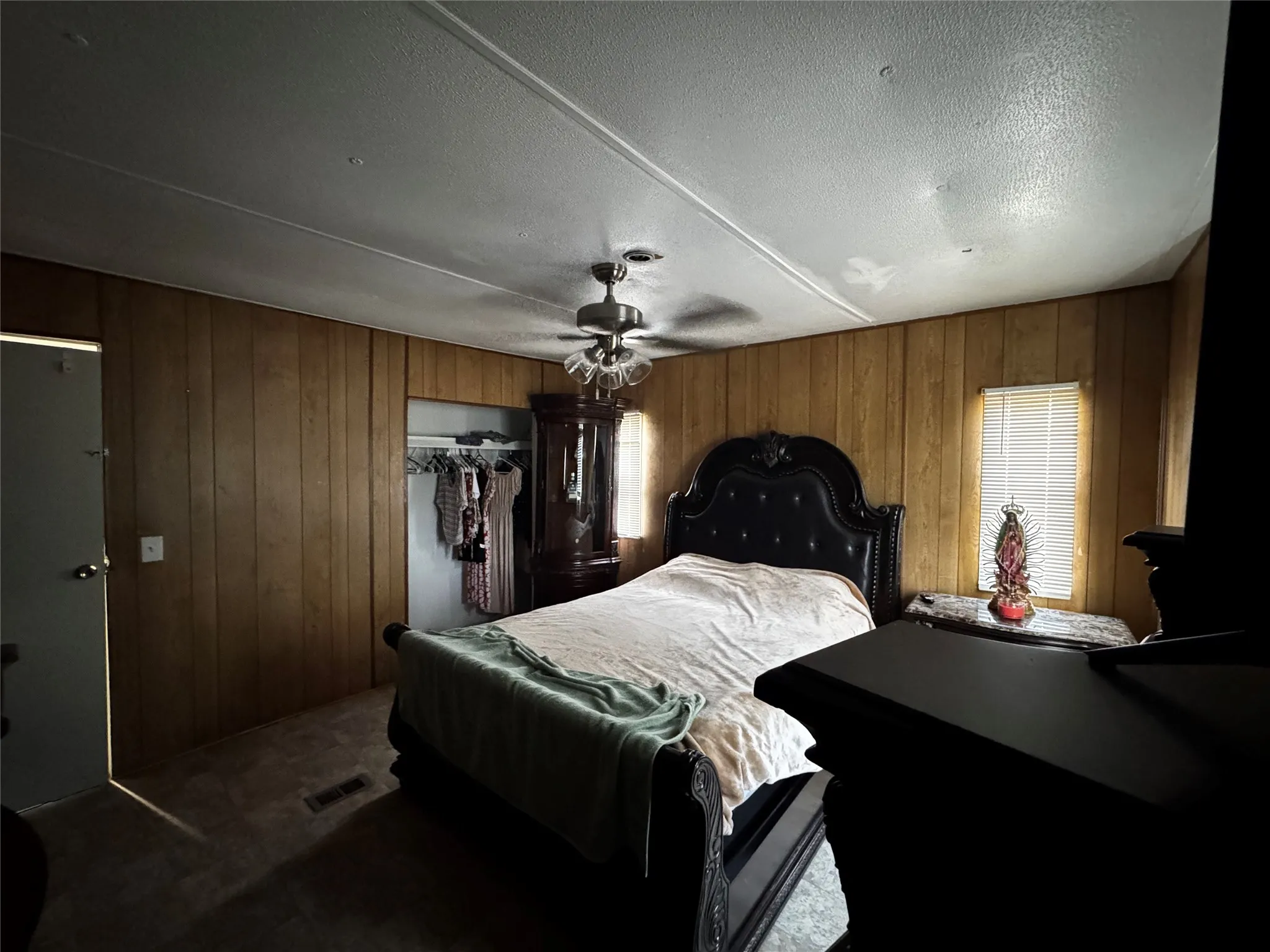 Paneling walls and ceiling fan with light fixture