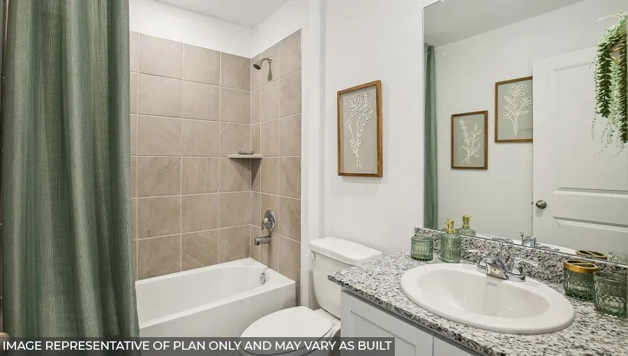 Full bathroom featuring a tub-shower combination with floor-to-ceiling tile surround, an integrated corner shelf, a single vanity with a granite-style countertop, and a chrome faucet