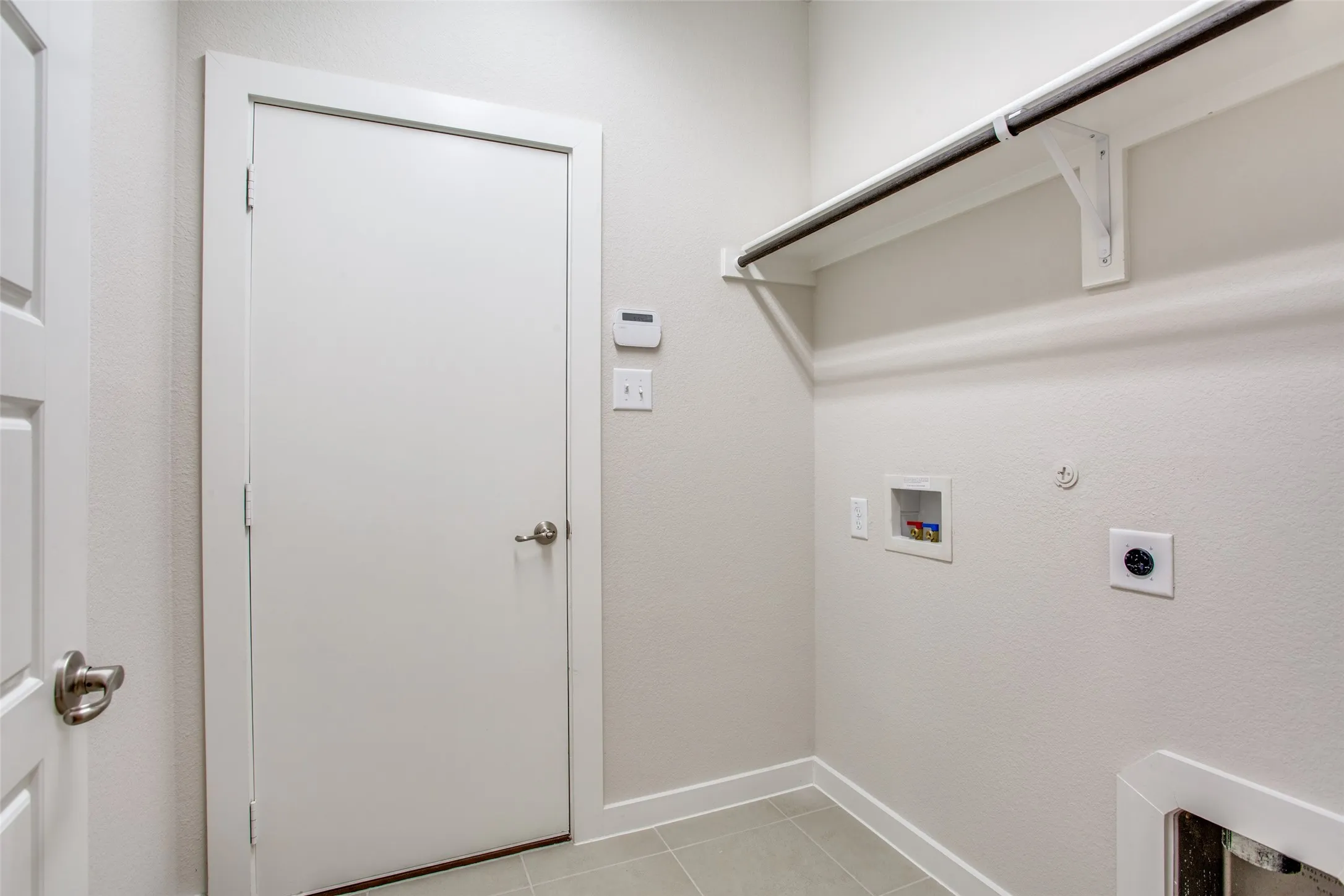 Roomy utility with shelf and hanging space