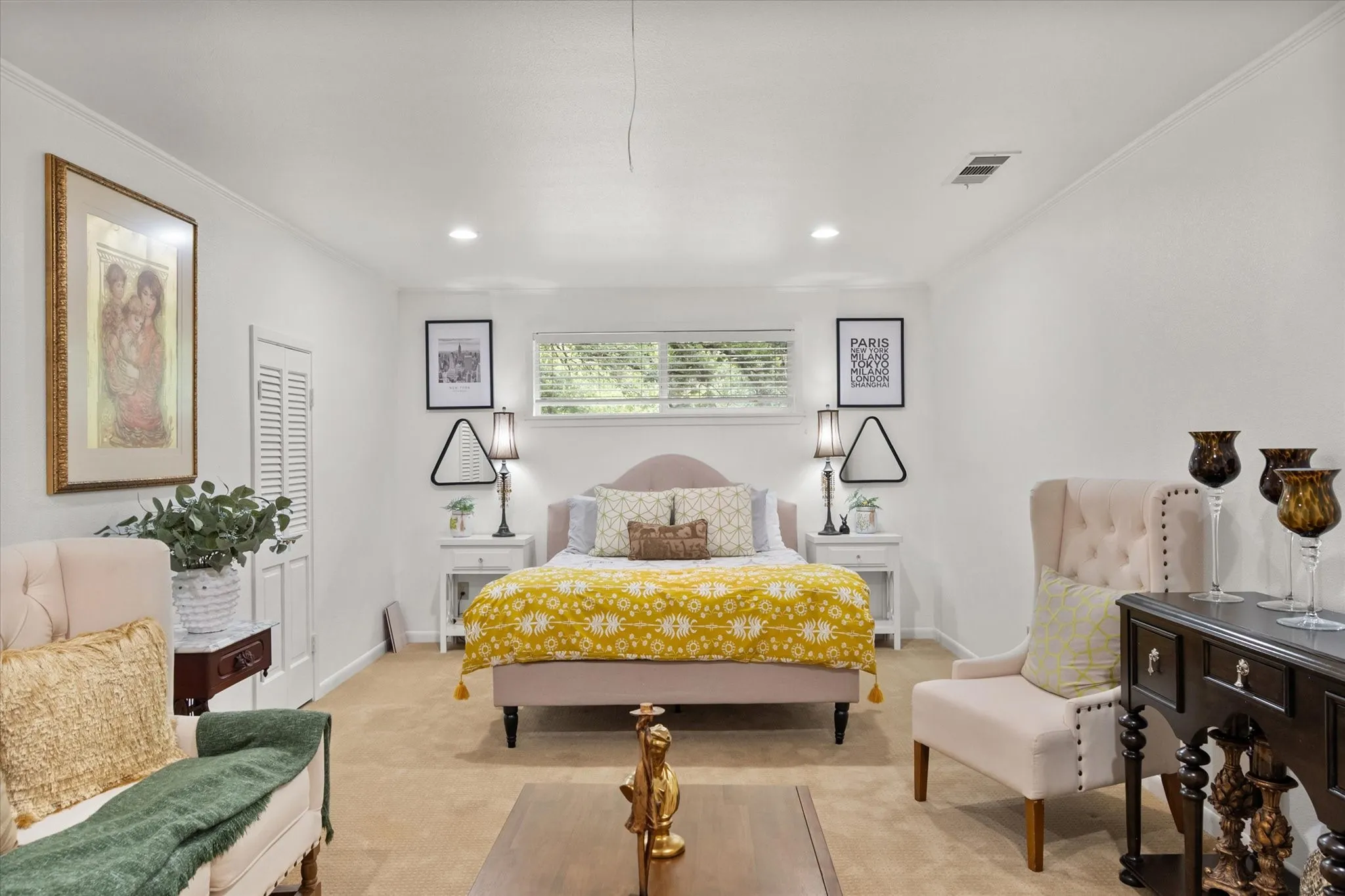 Spacious room featuring neutral carpet flooring and white painted walls