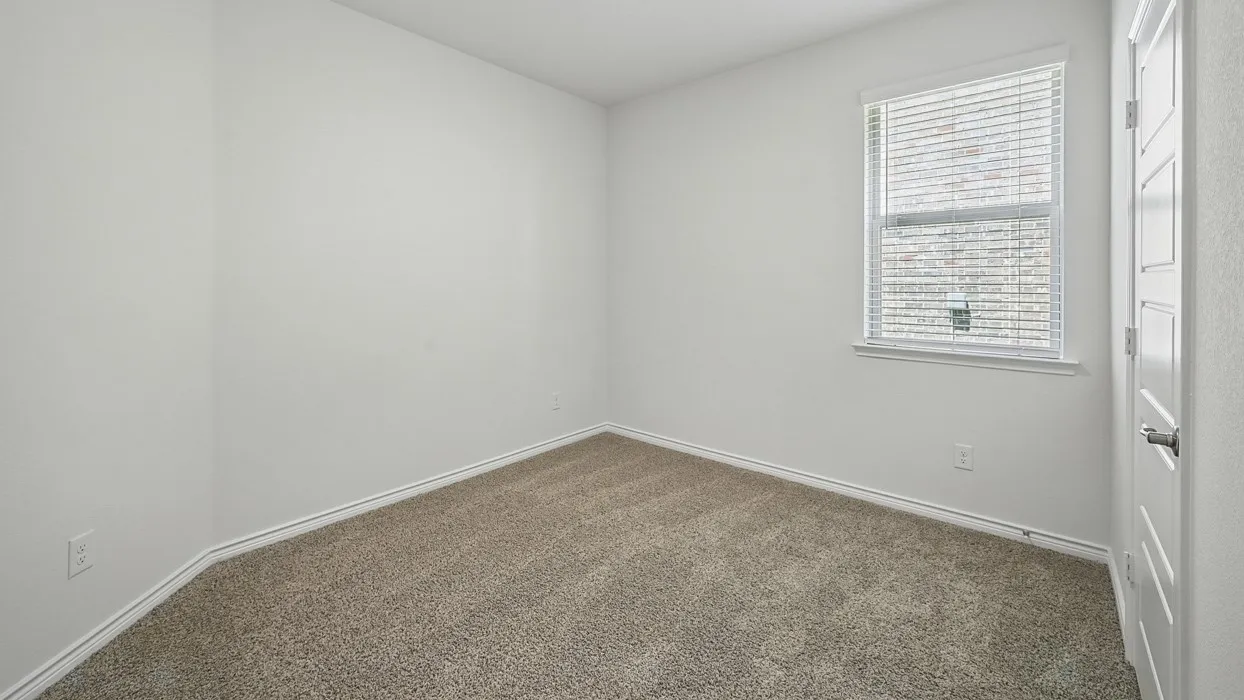 Carpeted room with white walls, a white trim baseboard, and a window with white blinds