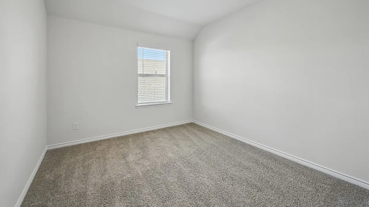 Room featuring neutral-toned carpeting, white painted walls, and a single window with horizontal blinds