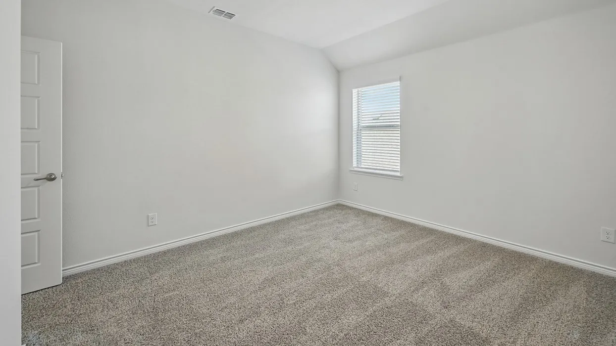 Neutral-toned wall-to-wall carpeting and bright white walls