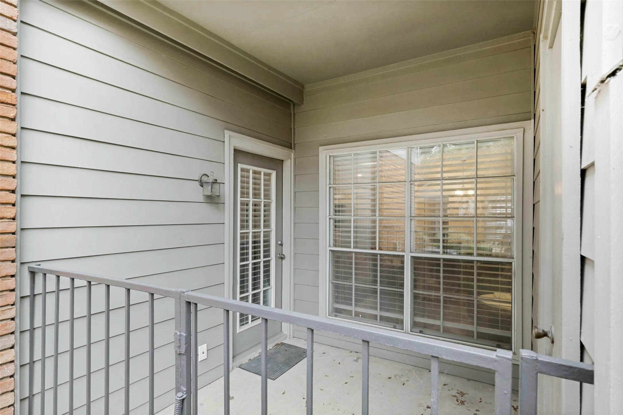 Exterior covered patio with a storage closet